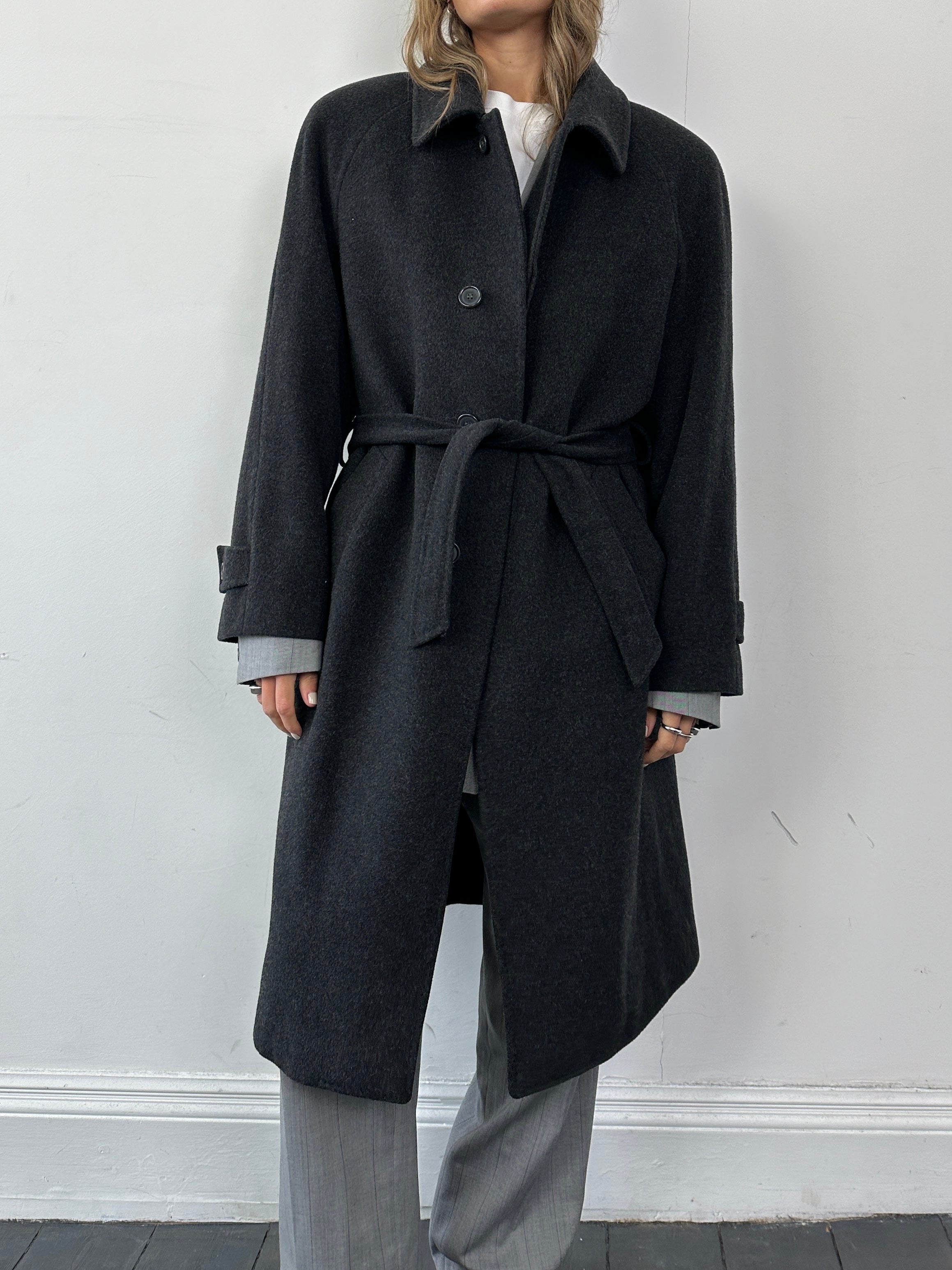Vintage Italian vintage wool and cashmere coat with concealed placket, belted, in size L/XL, showcasing classic design and textured fabric.