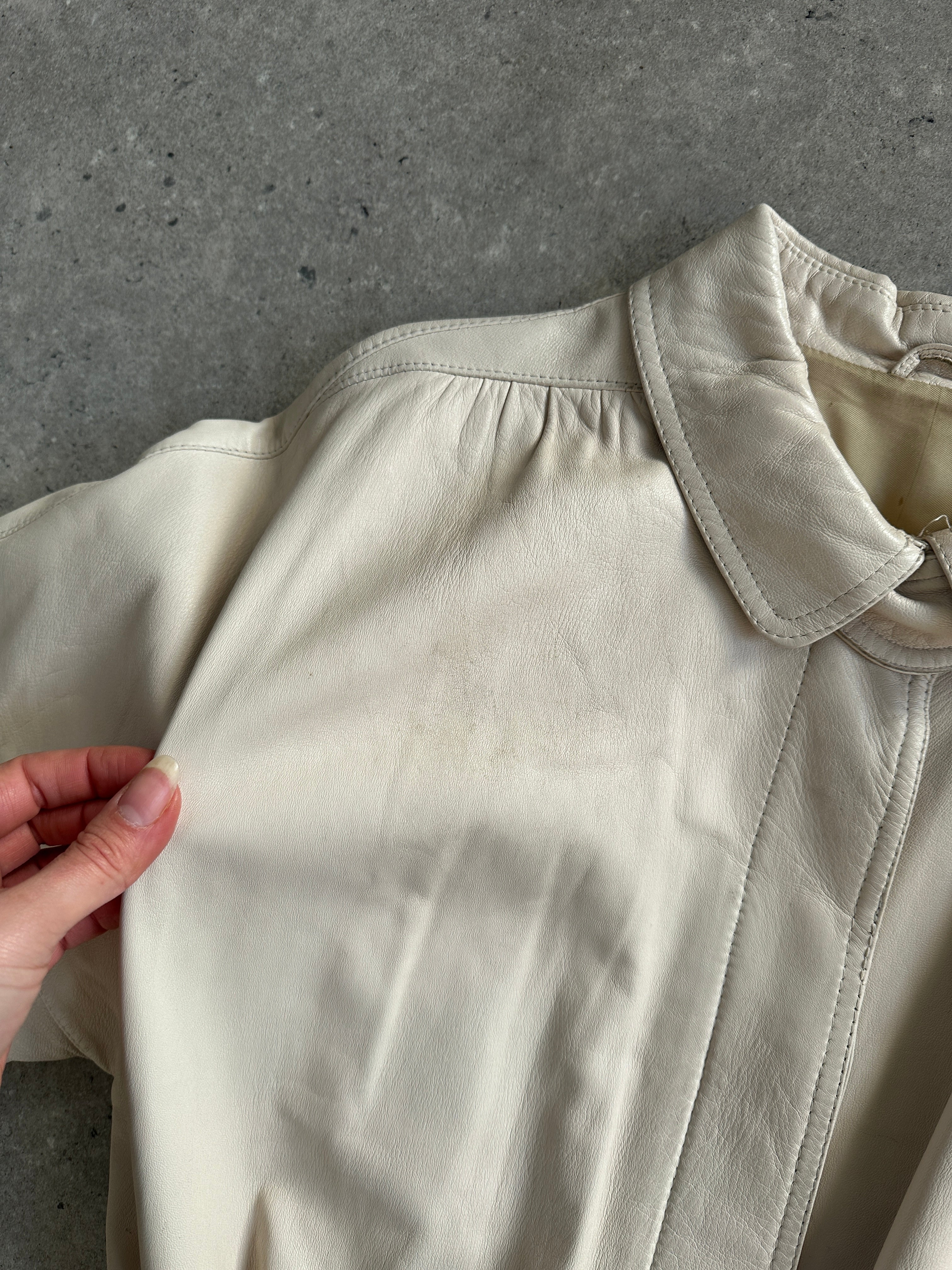 Vintage leather trench coat with belt, classic design, long sleeve, tailored fit, in natural leather finish.