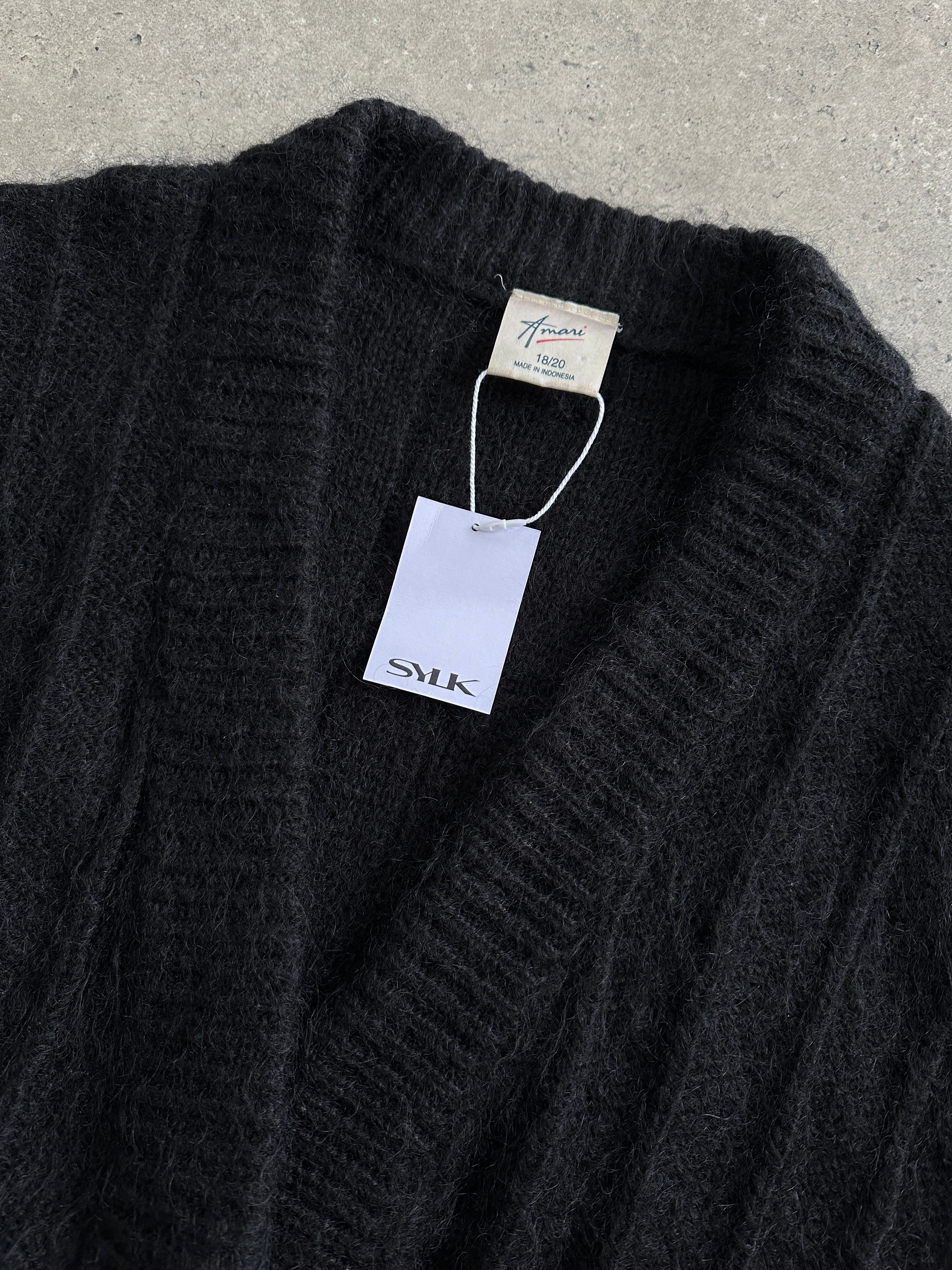 Vintage mohair knitted cardigan in size M, featuring a cozy, textured design and classic button closure, perfect for stylish layering.