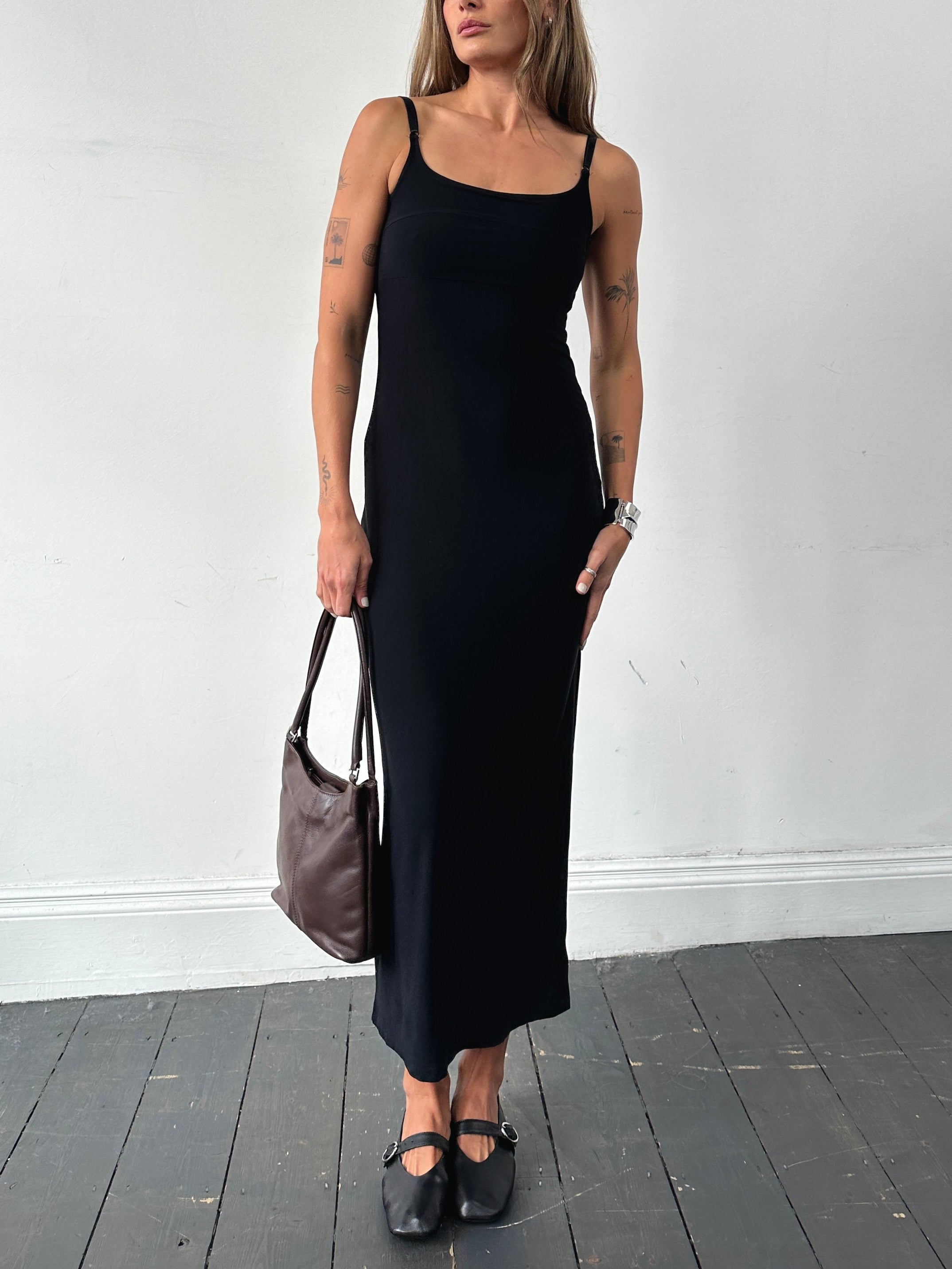 Vintage 90s side split stretch maxi dress in black, featuring a fitted silhouette and flowing fabric, perfect for casual or dressy occasions.