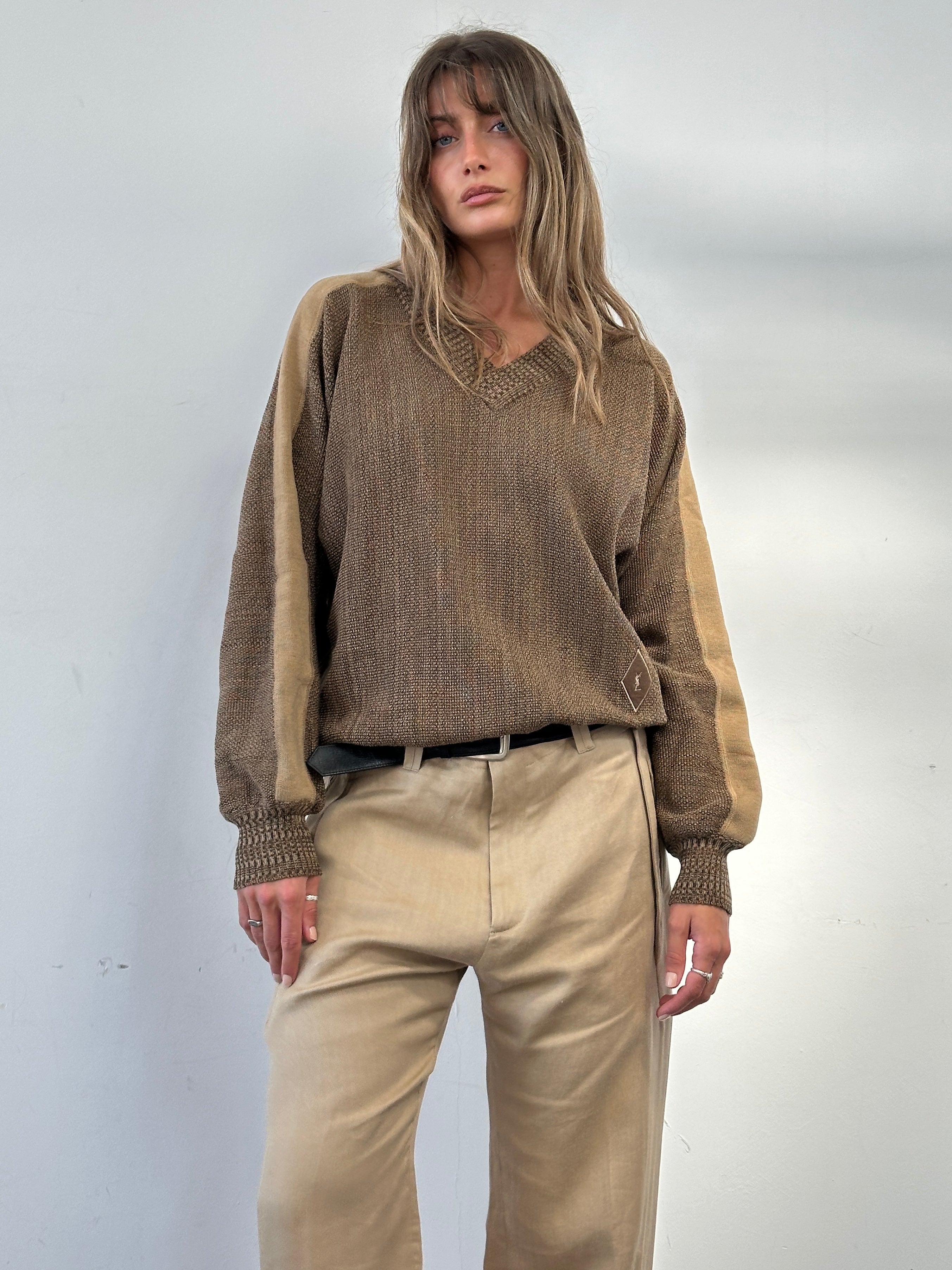 Yves Saint Laurent Tricots 80s pure wool V-neck jumper in size M/L, beige color, showing the knit texture and V-neck design.