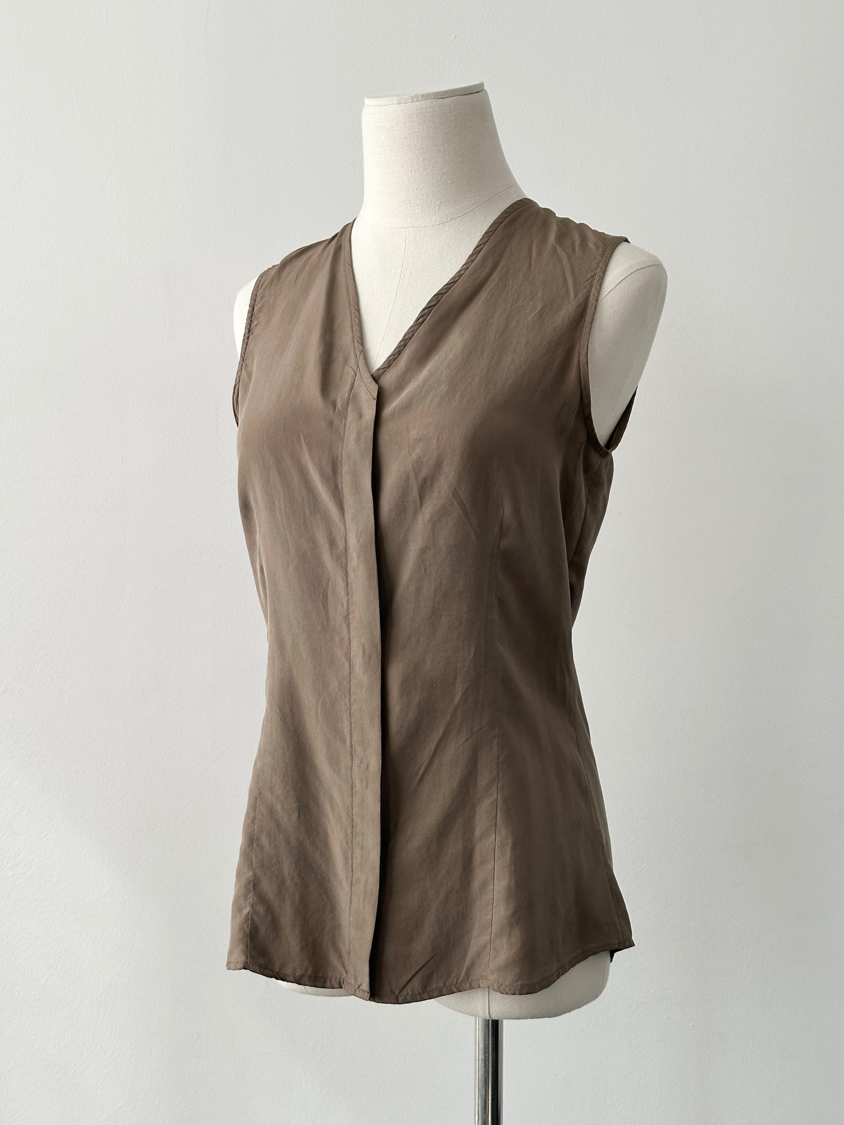 Emporio Armani 2000s pure silk sleeveless top in minimal style, shown in a light color with a sleek neckline.