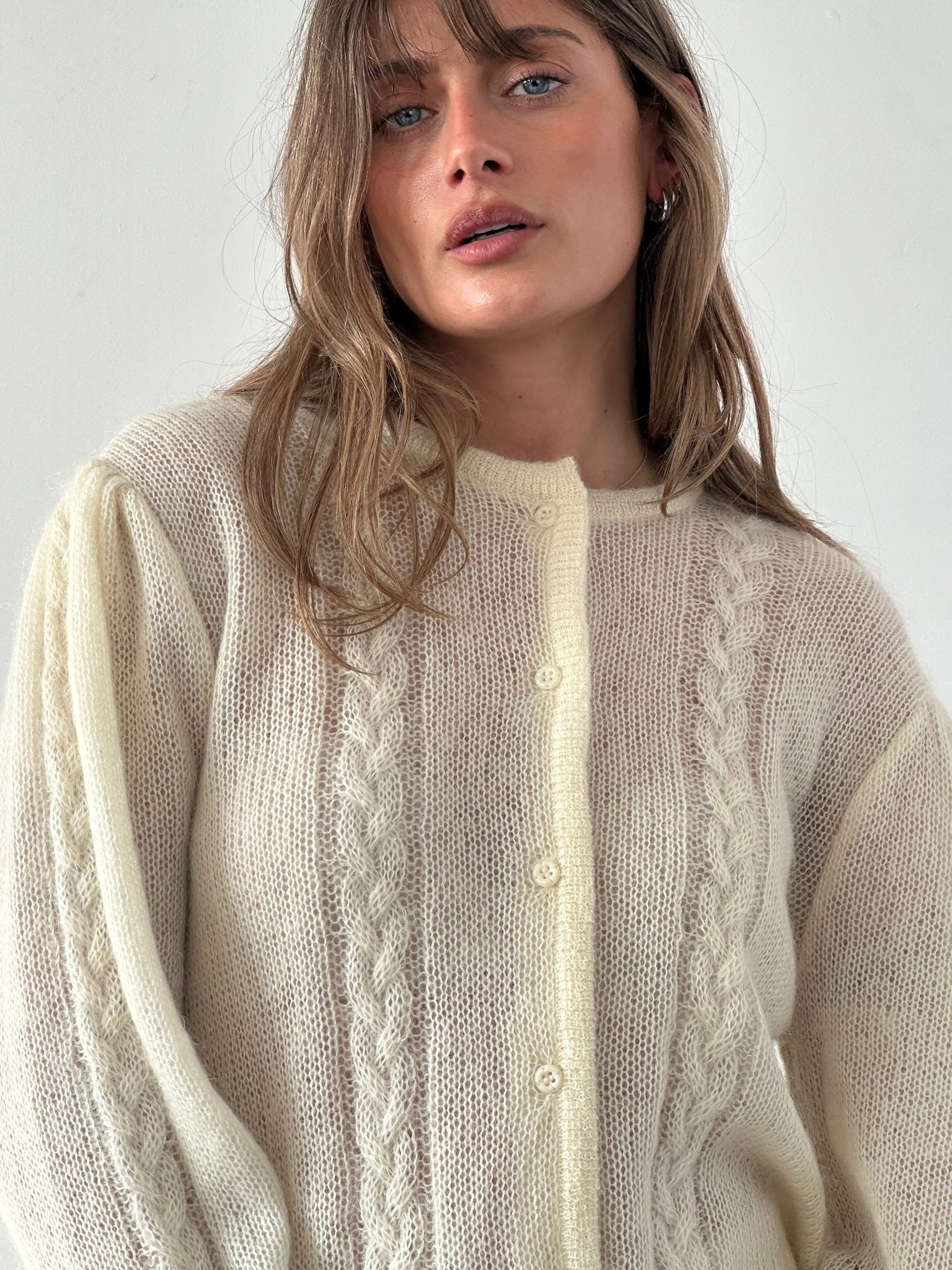 Vintage wool mohair cardigan in size L featuring a cozy, textured knit and classic design.