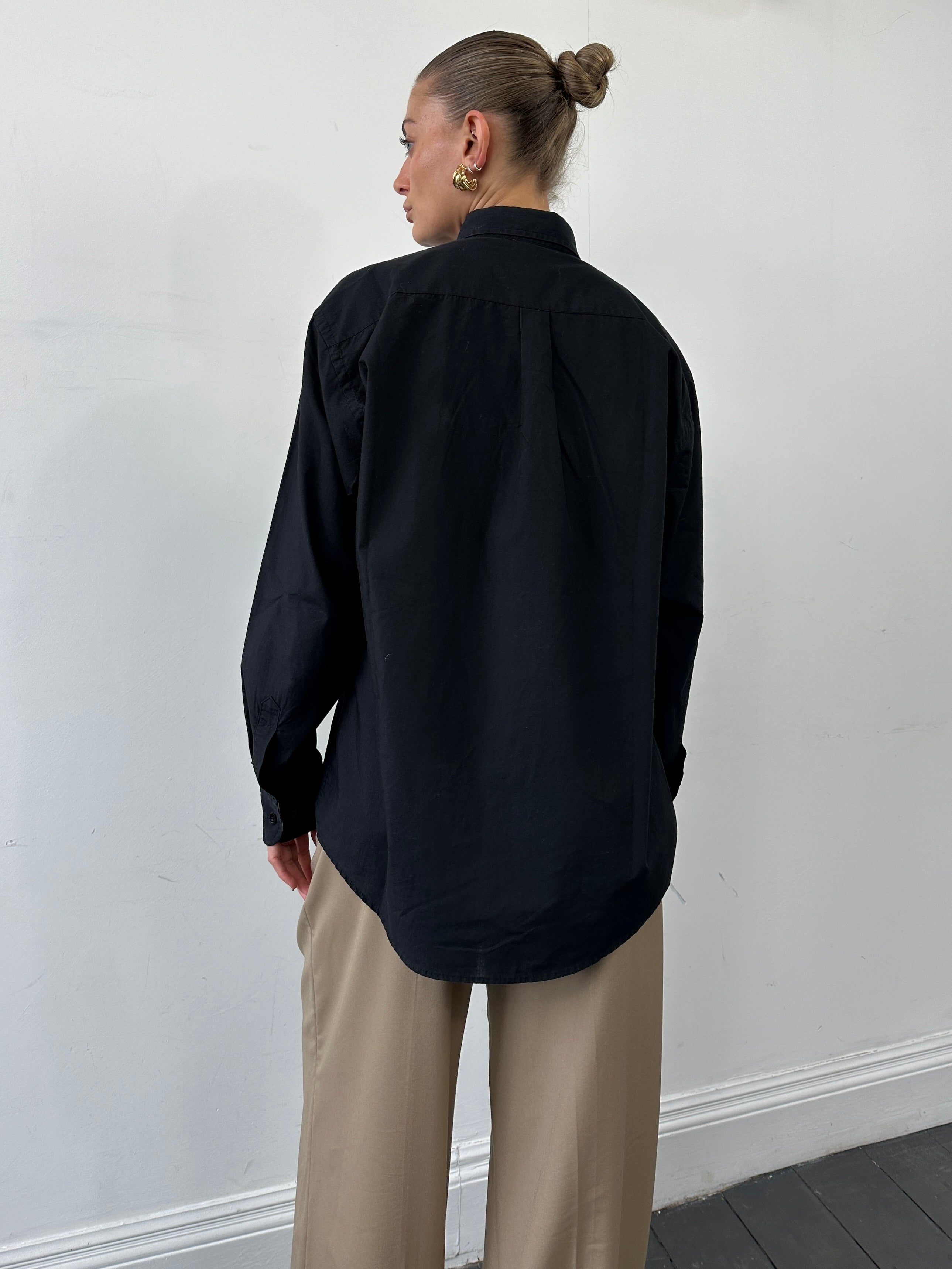 Burberry London pure cotton logo shirt in size XL, featuring a classic design and recognizable brand logo on the front.