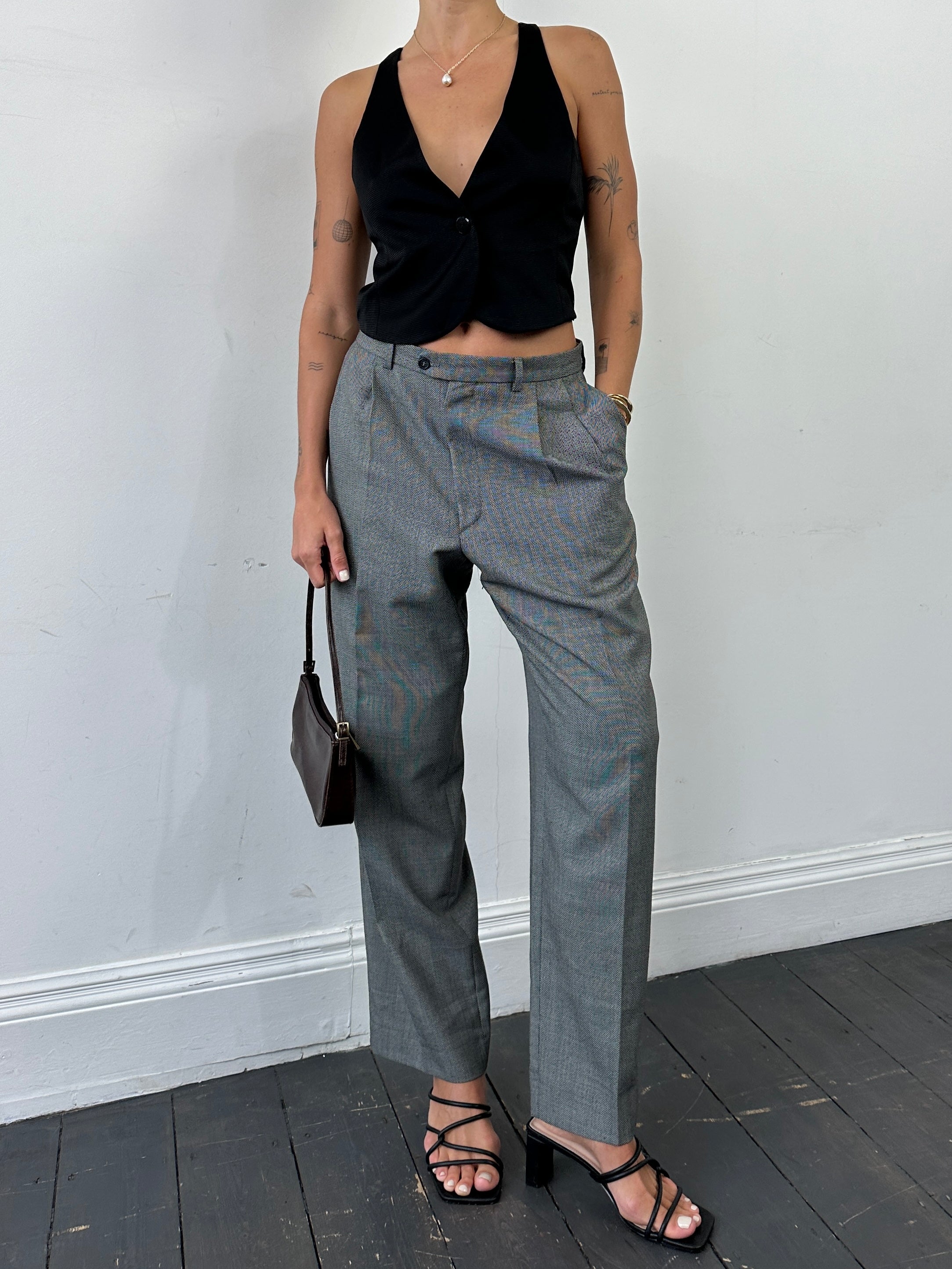 Yves Saint Laurent tailored high-waisted straight leg trousers in black fabric, size W35, shown on a model.
