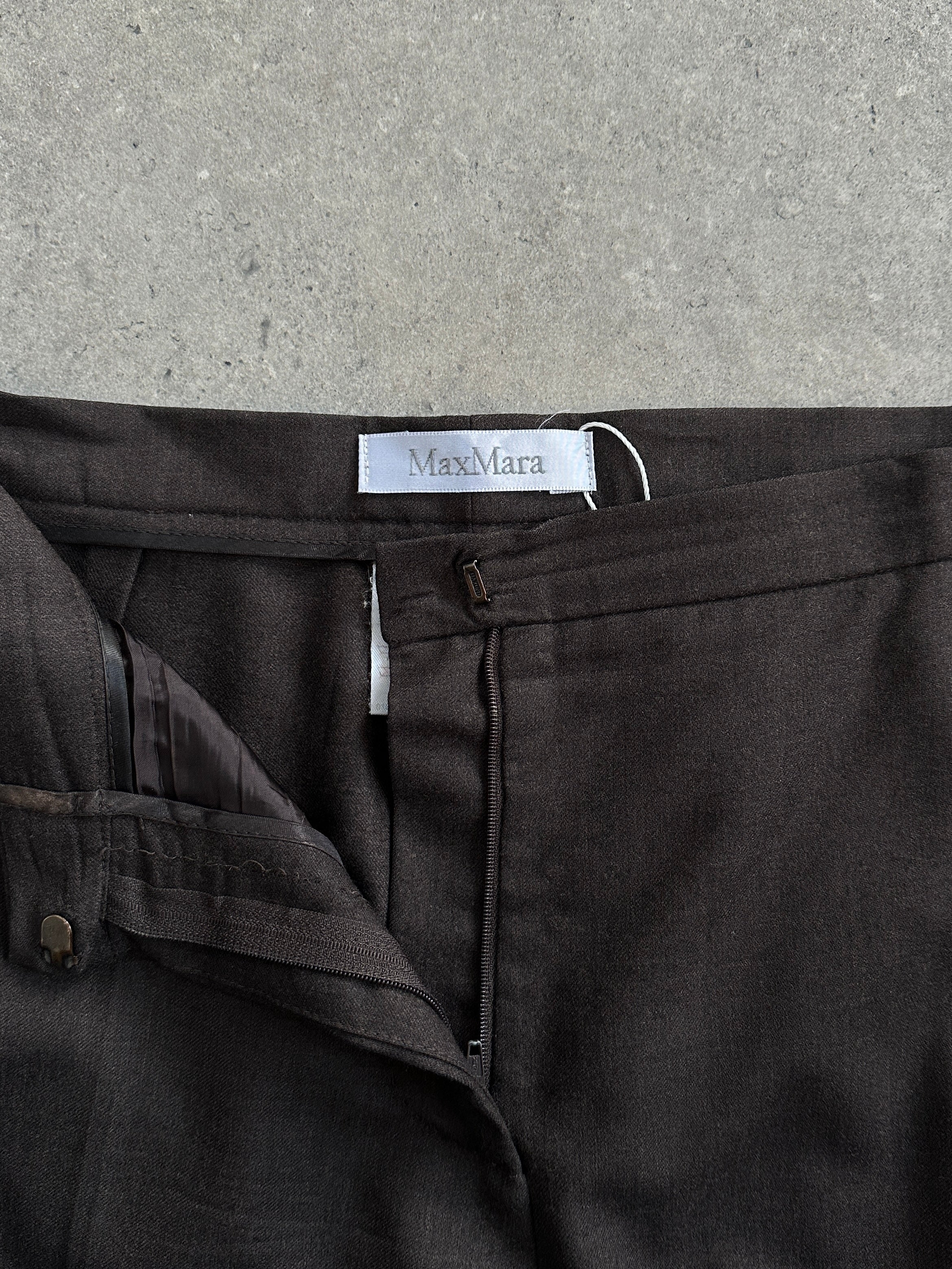 Max Mara tailored wool trousers with straight leg and low-mid rise in virgin wool, size W32, shown on a model.