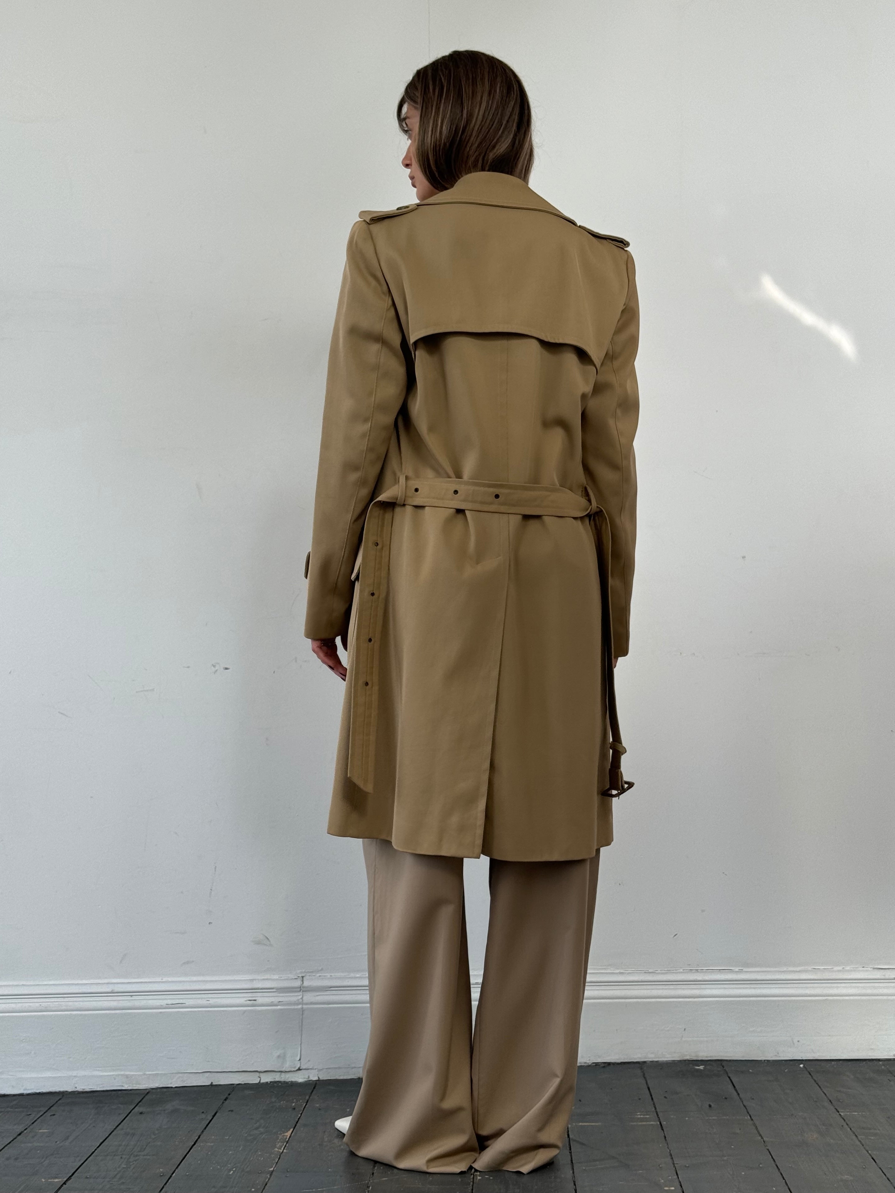 Vintage wool double-breasted trench coat in size L, featuring classic style and tailored fit in neutral tones.