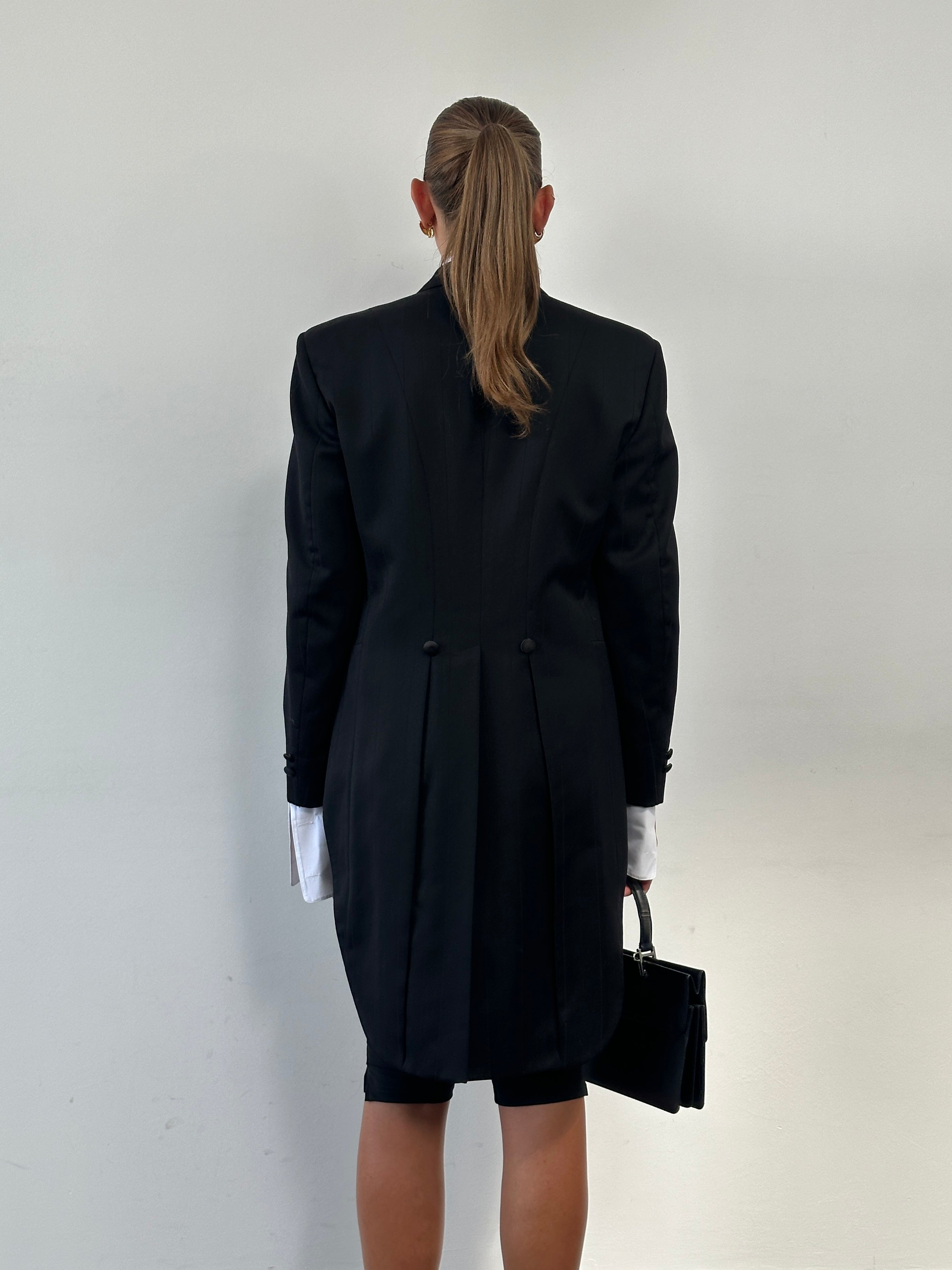 Christian Dior Monsieur 80s double-breasted tuxedo blazer with peak lapels and tailored fit, displayed on a hanger.