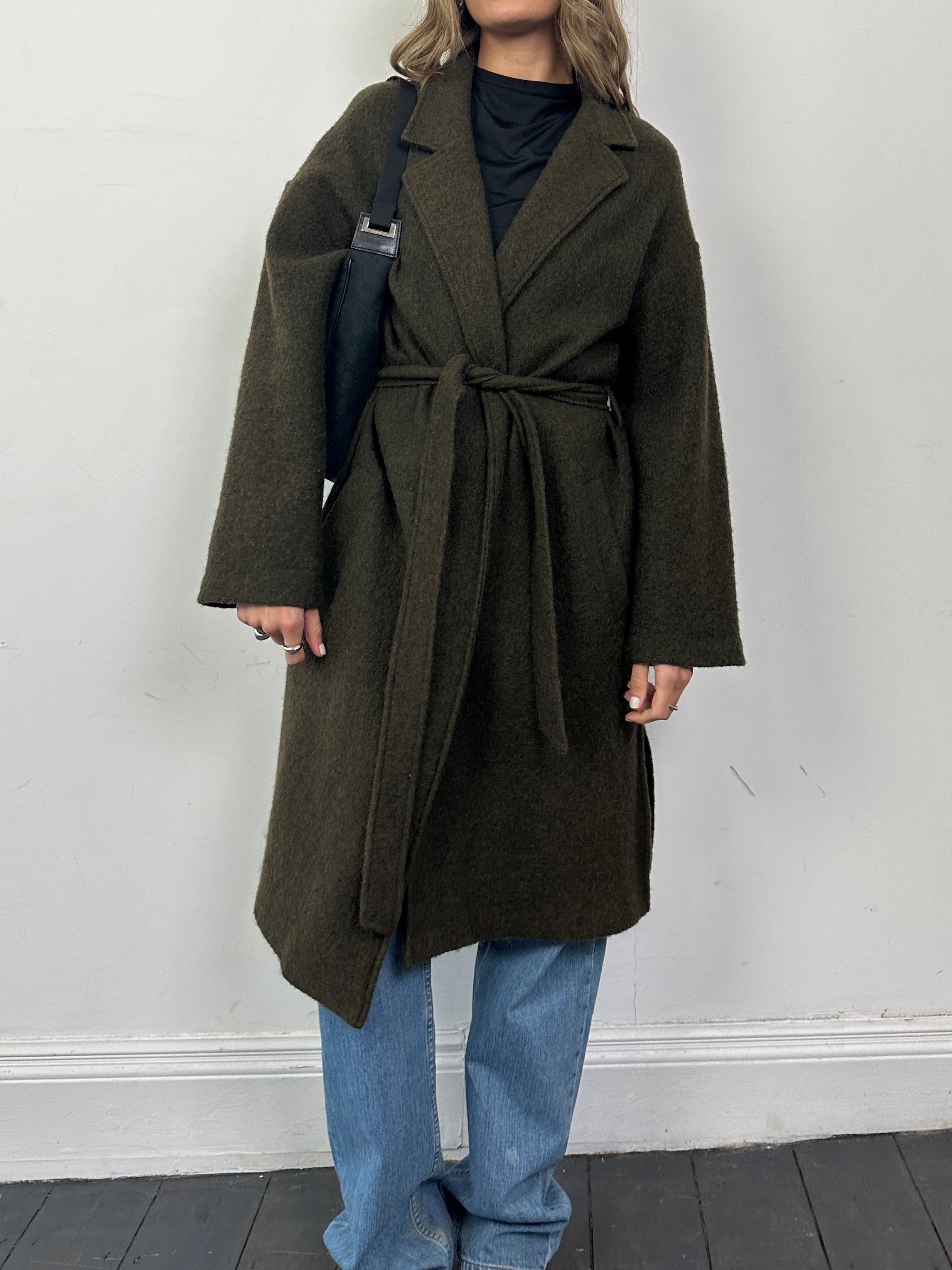 Nicole Farhi pure wool unlined belted wrap coat in size large, shown in a natural beige color with a classic collar and belt detail.