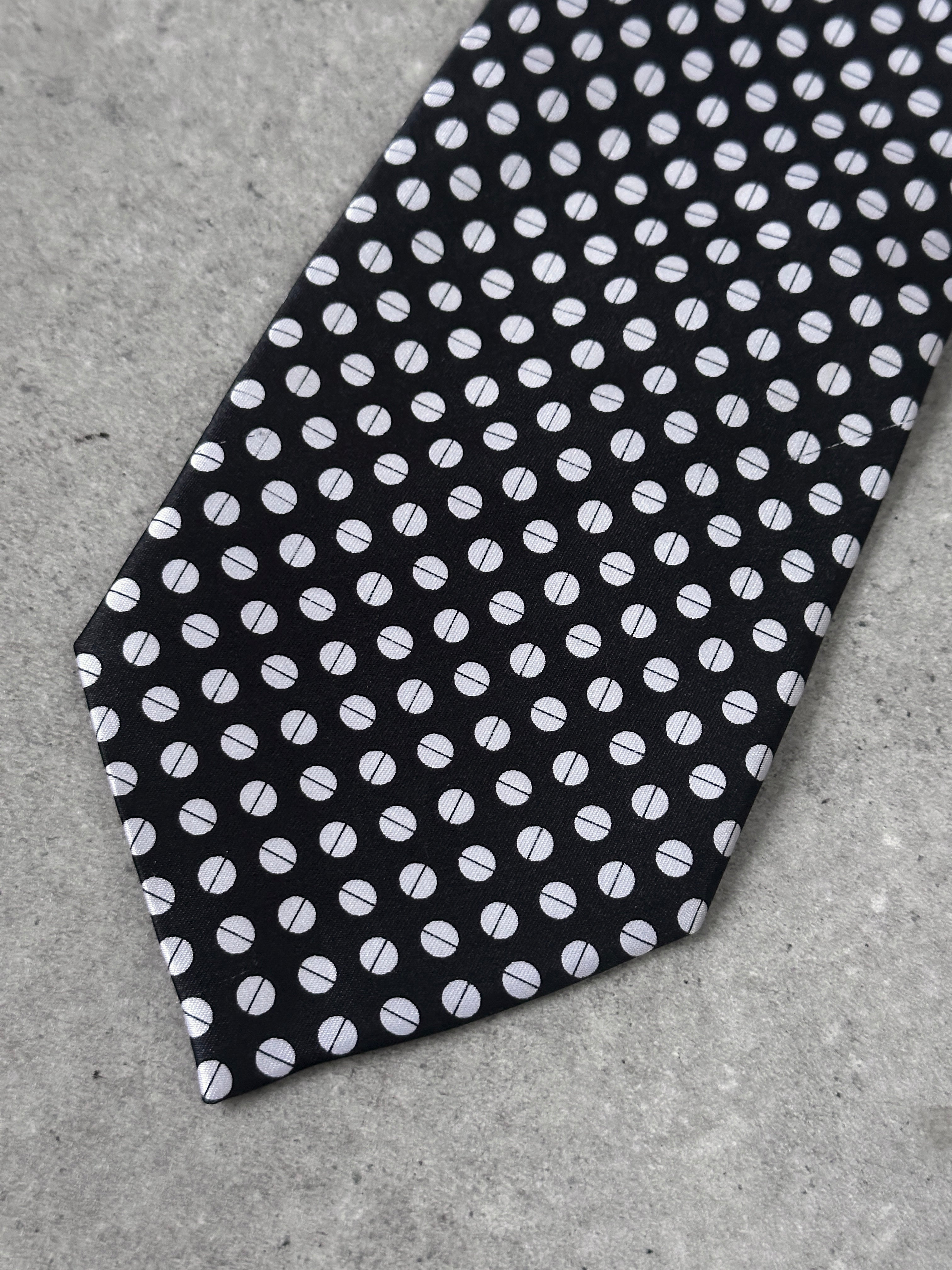 Vintage 1990s pure silk polkadot tie with a classic pattern, showcasing smooth fabric and vibrant dot design.