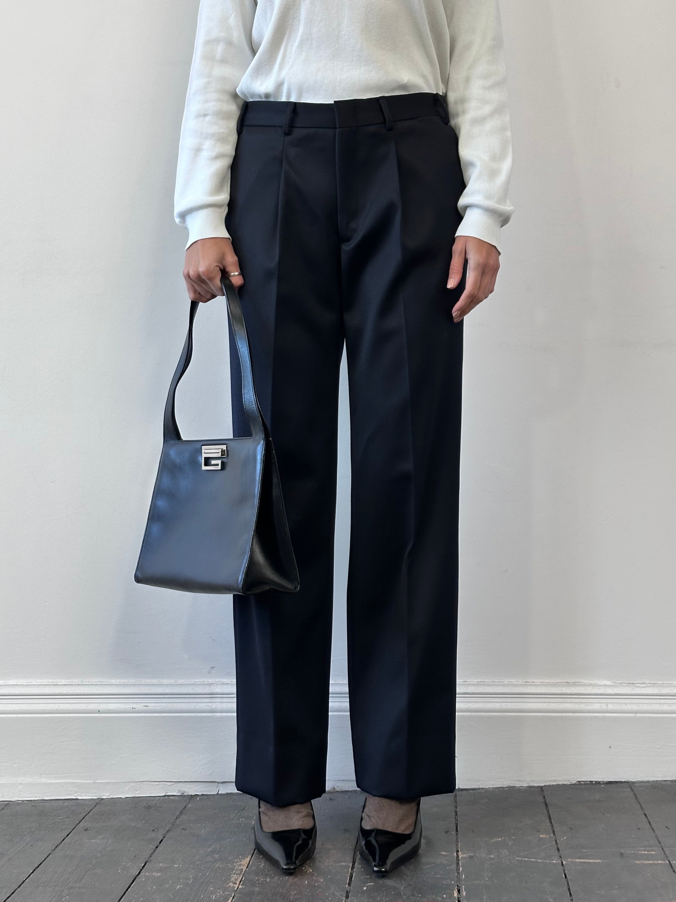Vintage Italian vintage pure wool tailored trousers in size W32, showing classic fit and detailed stitching.