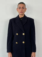 Versace Versus 1990s bespoke double-breasted coat in size M, featuring classic design and tailored fit, shown on a hanger.