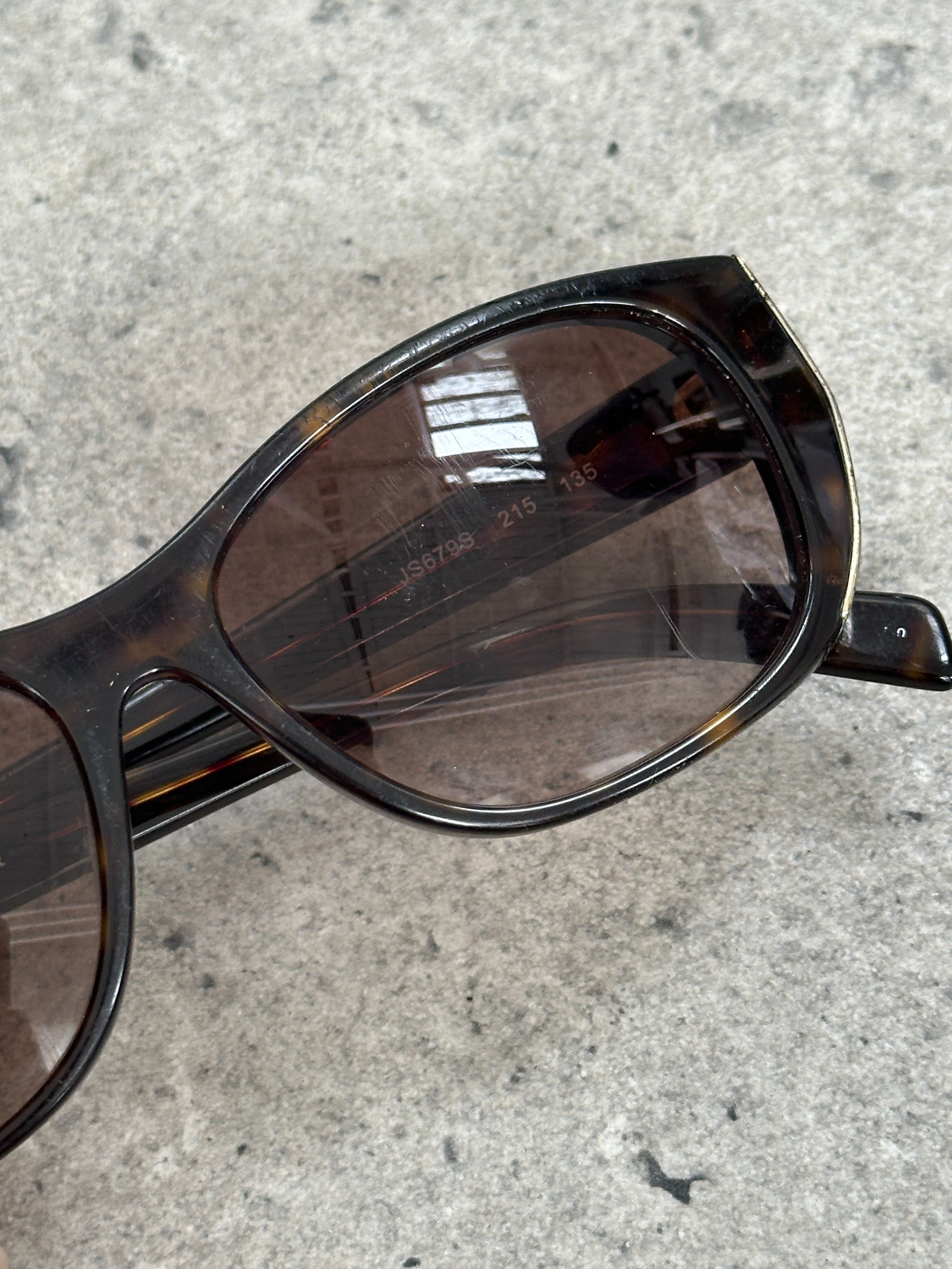 Jil Sander tortoiseshell rectangular logo sunglasses with dark lenses and bold frame, stylish and modern eyewear.