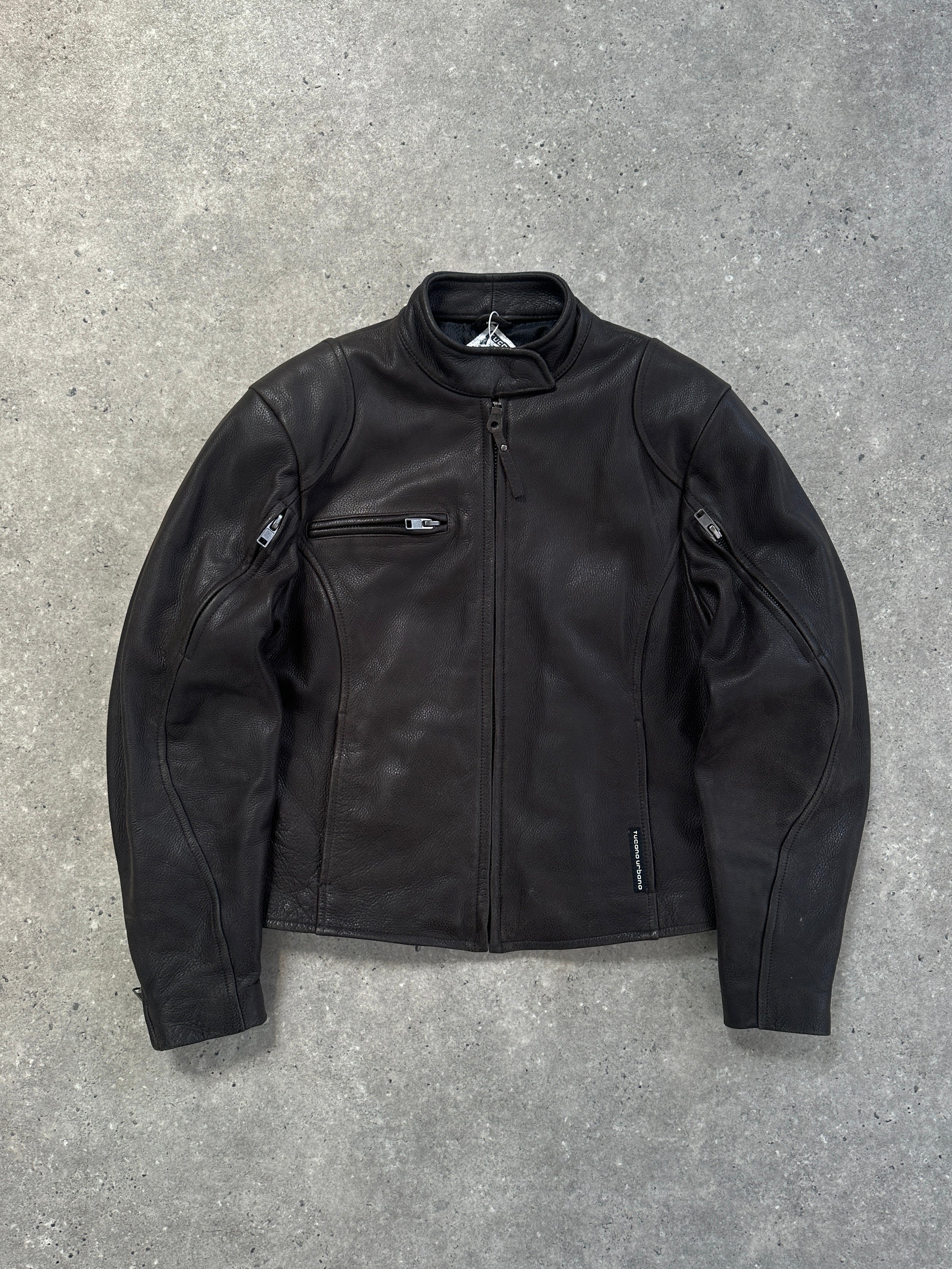 Vintage leather moto jacket in size S/M featuring classic design with rugged texture and stylish lapels.