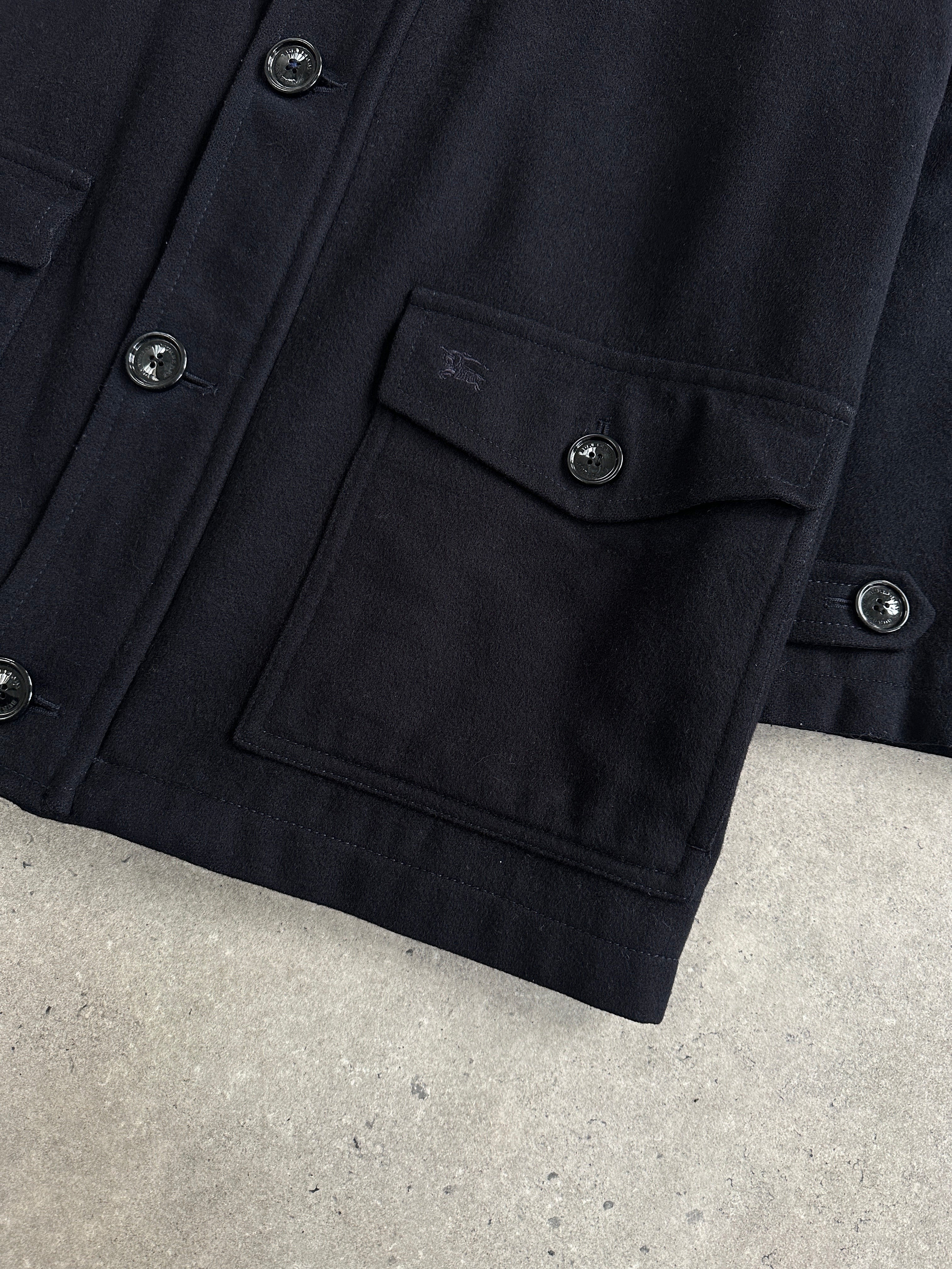 Burberry London 1990s wool single-breasted logo coat in size L/XL, featuring classic check pattern and tailored design.