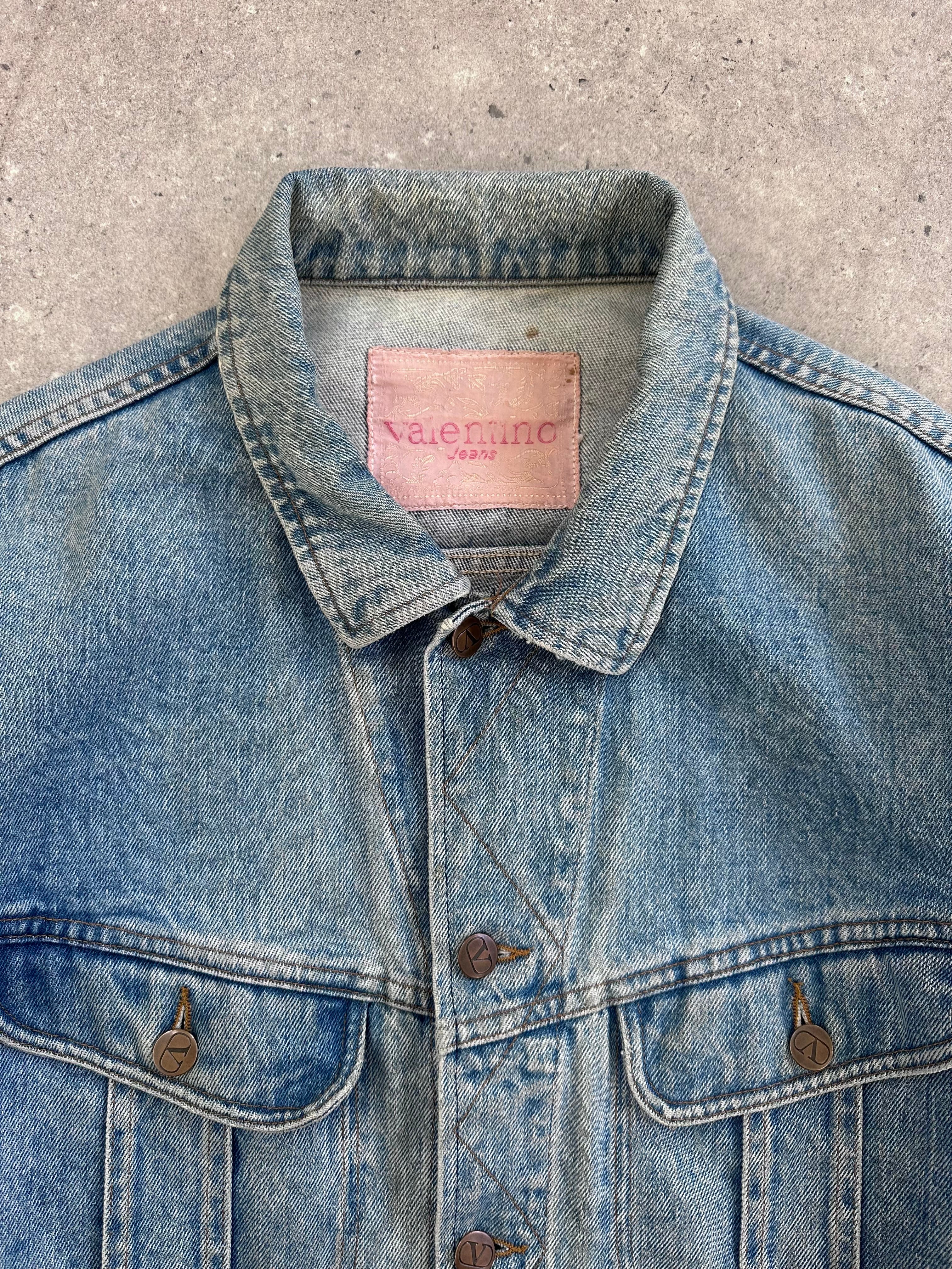Valentino XL denim jacket with classic design, showcasing denim fabric, button closures, and a stylish fit.