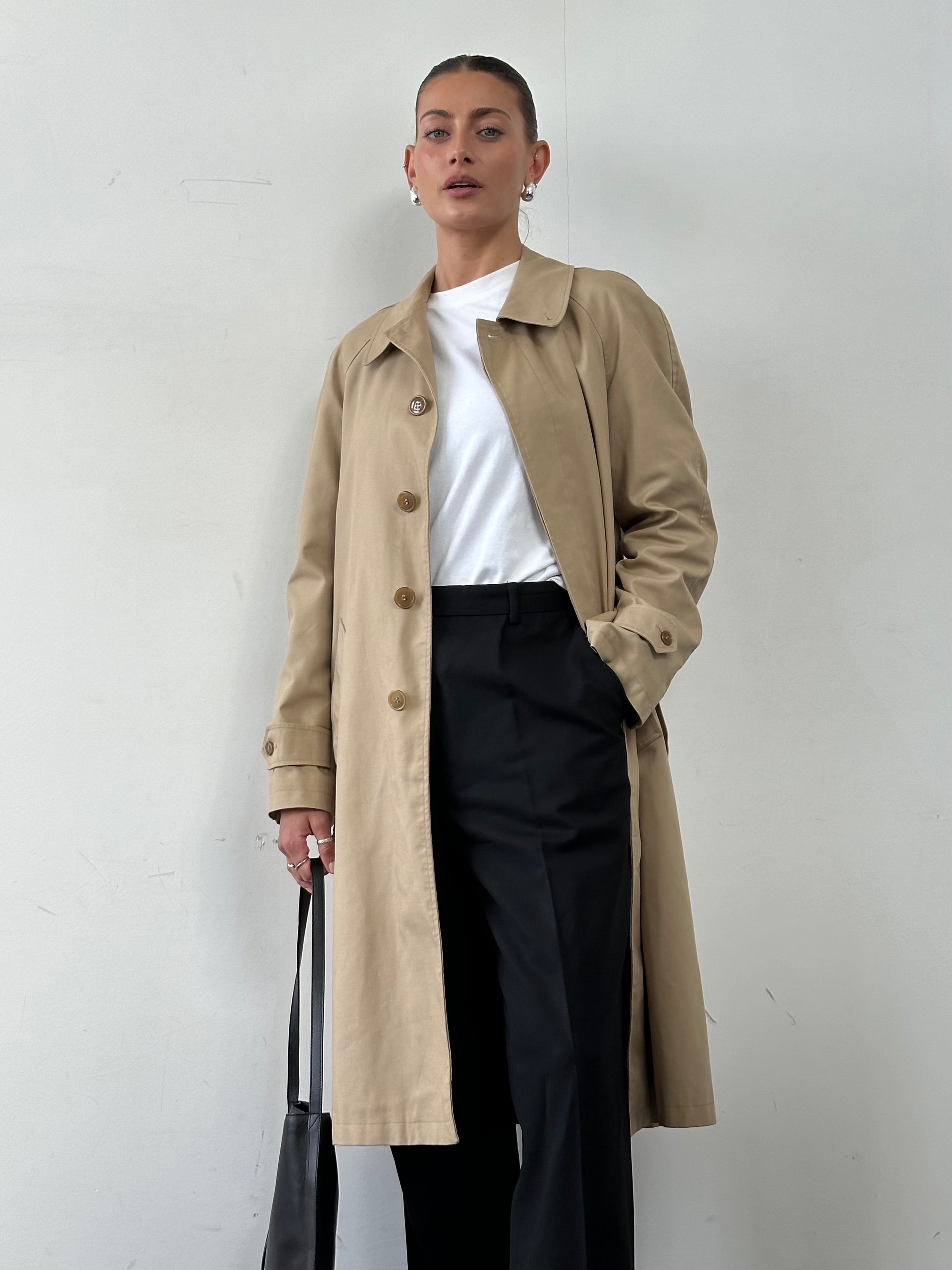 Vintage cotton belted trench coat in XL size, featuring classic design and neutral color, displayed on a hanger.