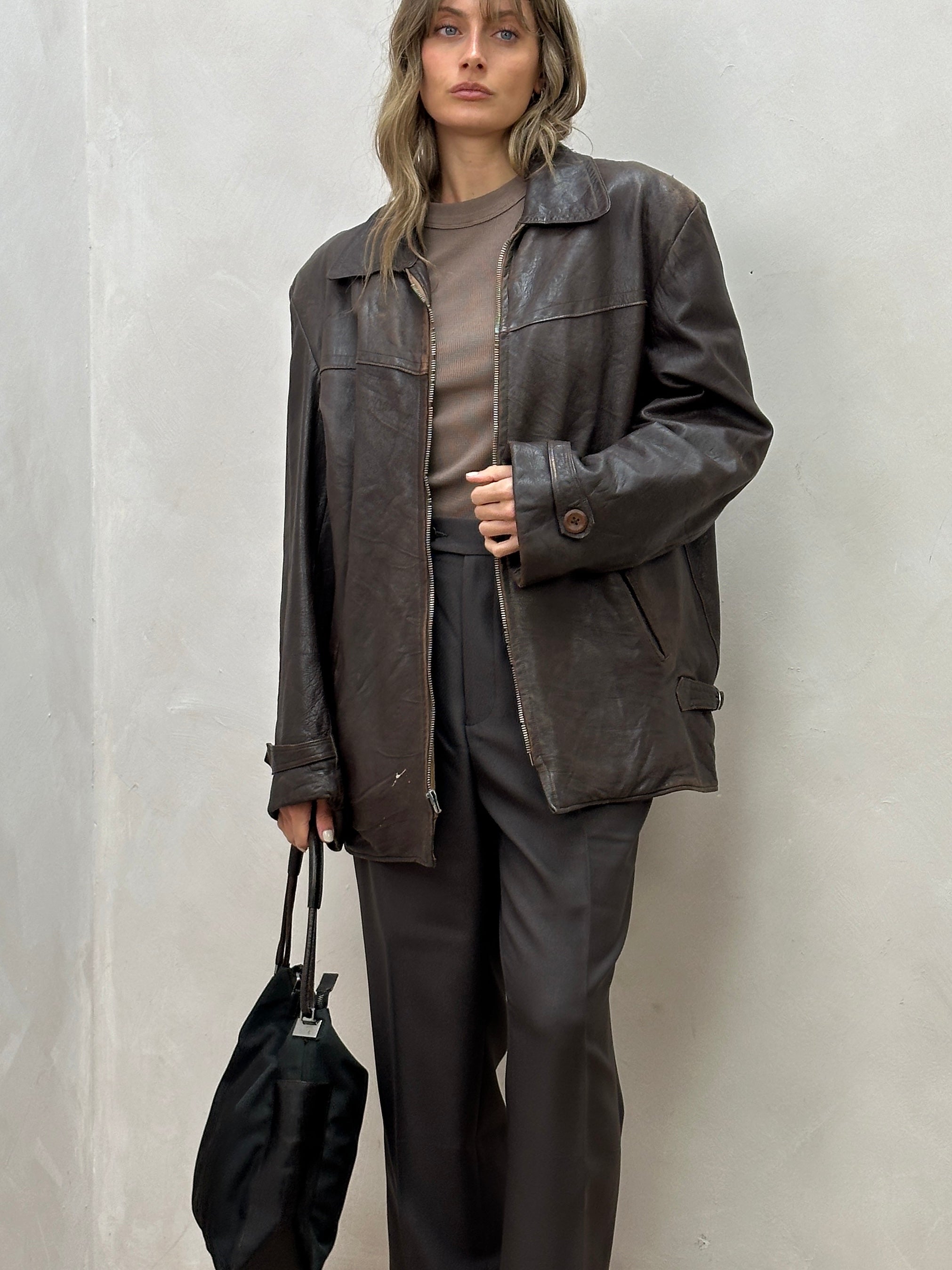 Vintage distressed mid-length leather jacket in XL size, featuring a rugged style and classic design.