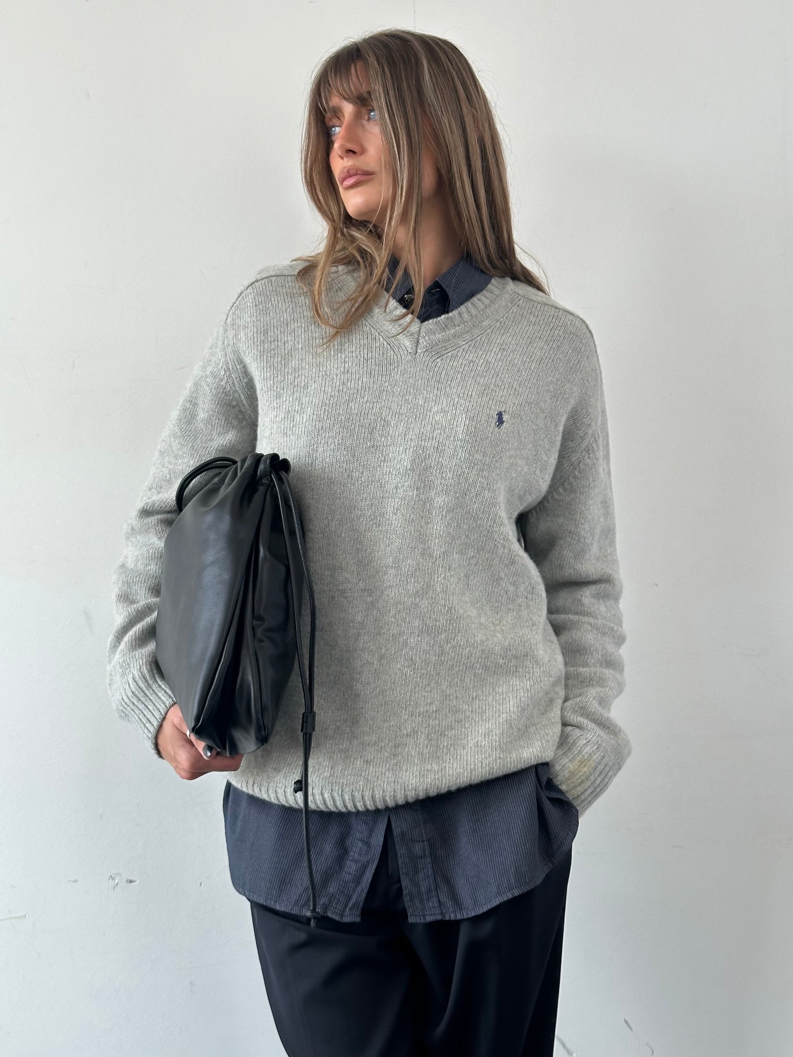 Ralph Lauren wool V-neck jumper in XL, featuring a classic design and soft knit texture, displayed on a neutral background.