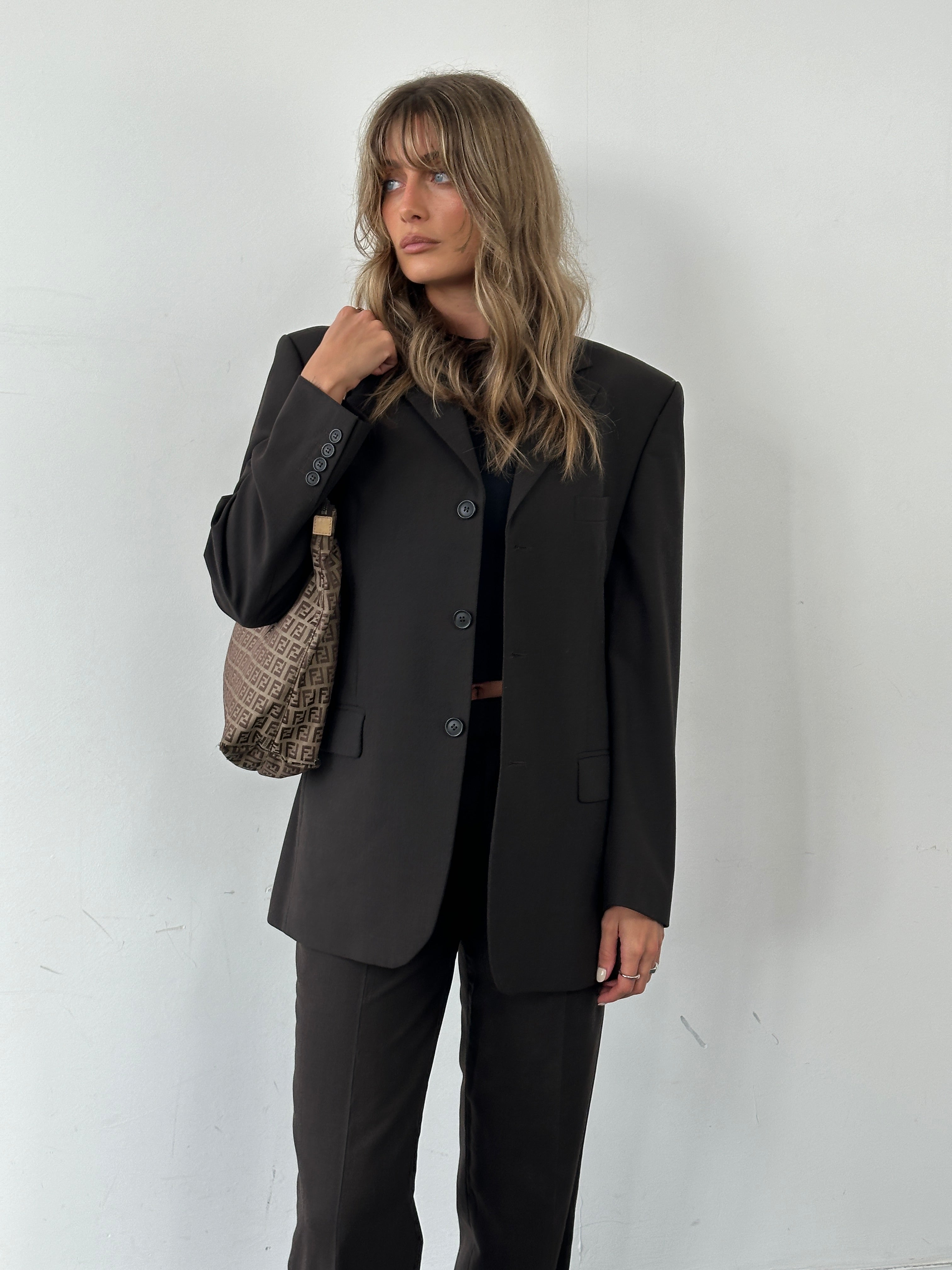 Vintage wool single-breasted jumpsuit in size 38R/W28, featuring a tailored vintage suit style with lapels and structured fit.