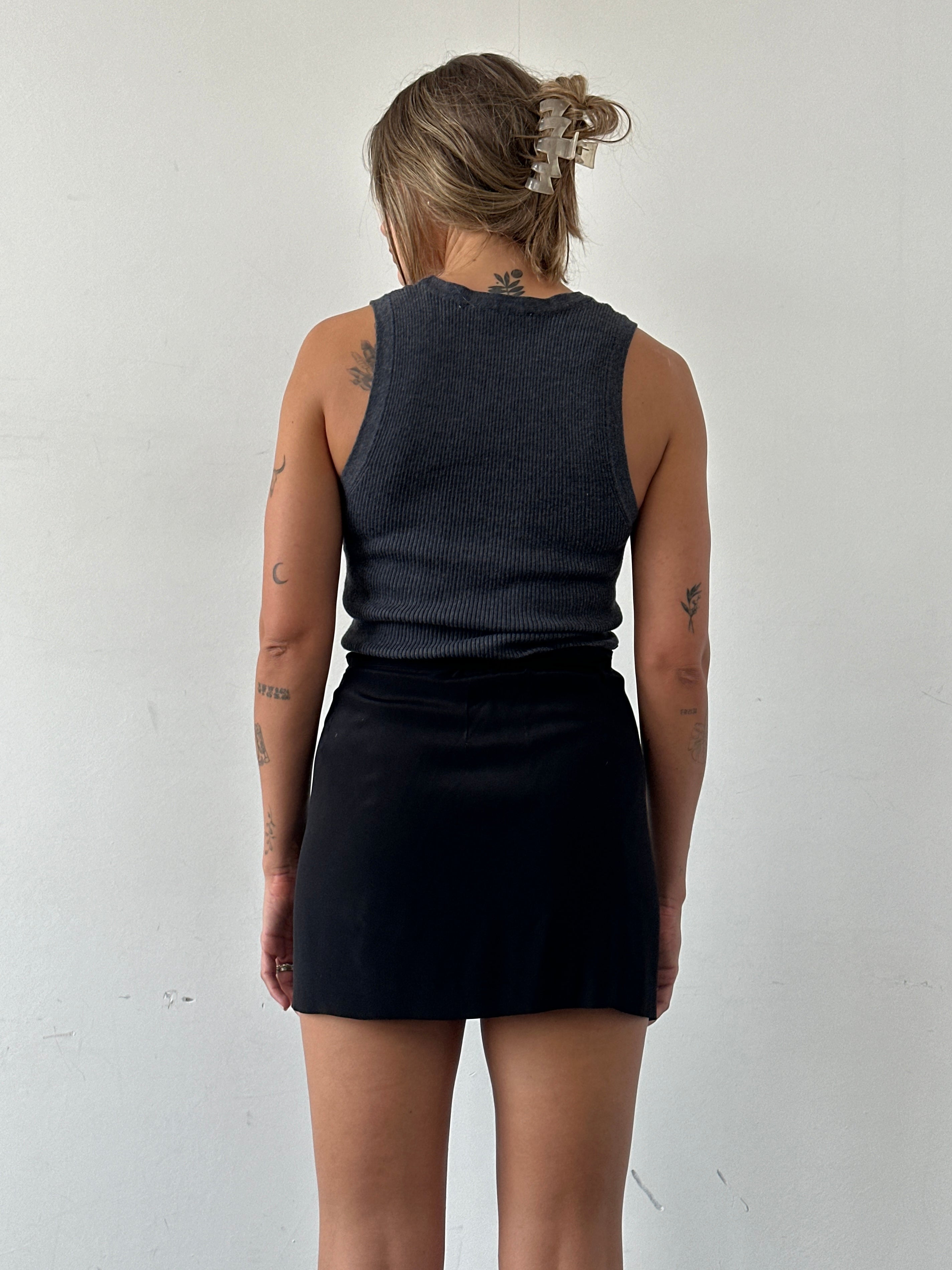 Vintage mini wrap skirt in earthy tones, featuring a classic design and adjustable waist for a stylish fit.