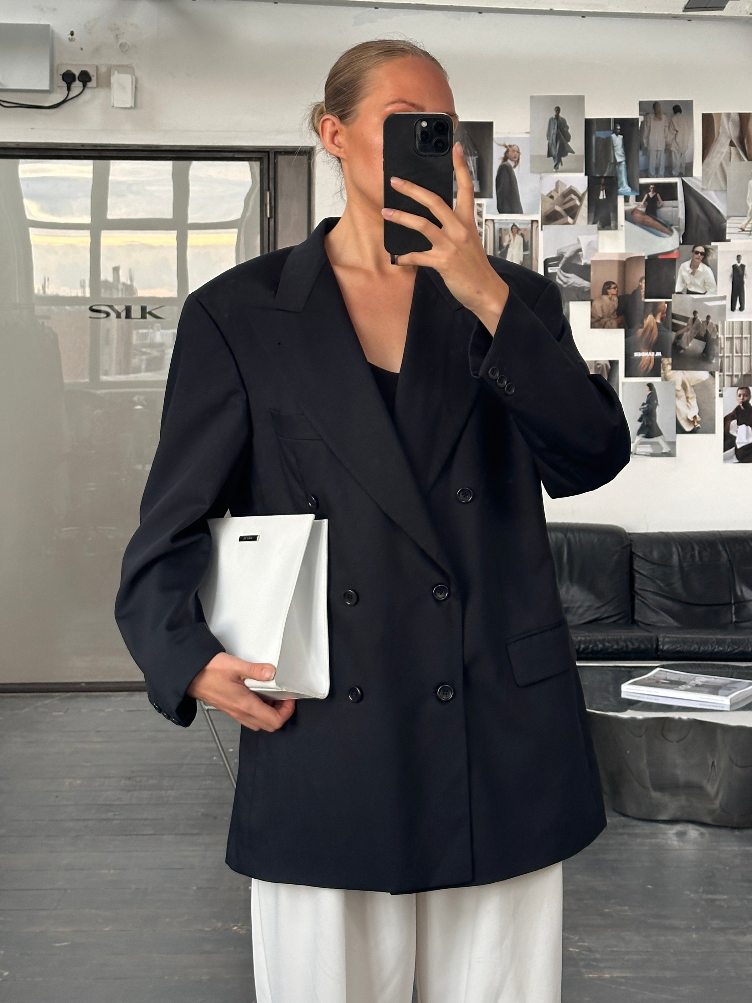 Hugo Boss x Loro Piana pure wool double-breasted blazer in size 40R/XL, shown on a mannequin with classic notch lapels.