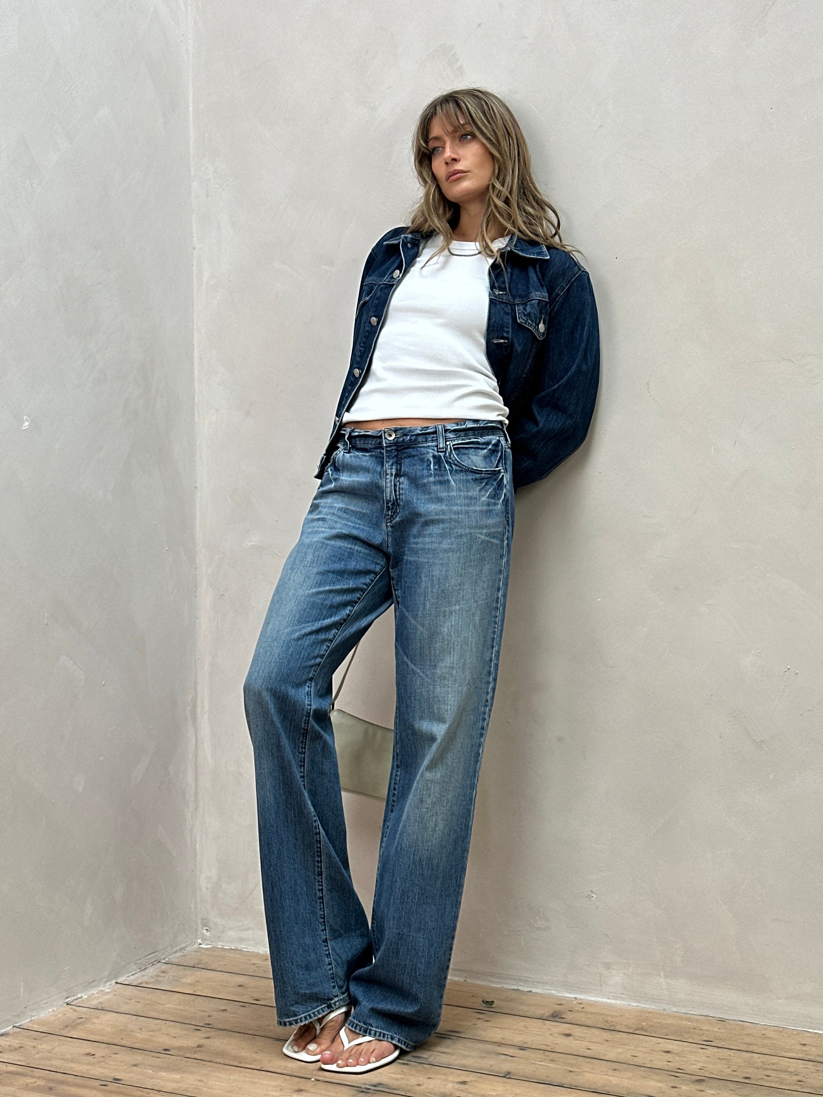 Armani Jeans stonewashed mid-waist denim jeans in size W34, featuring classic five-pocket design and modern fit.