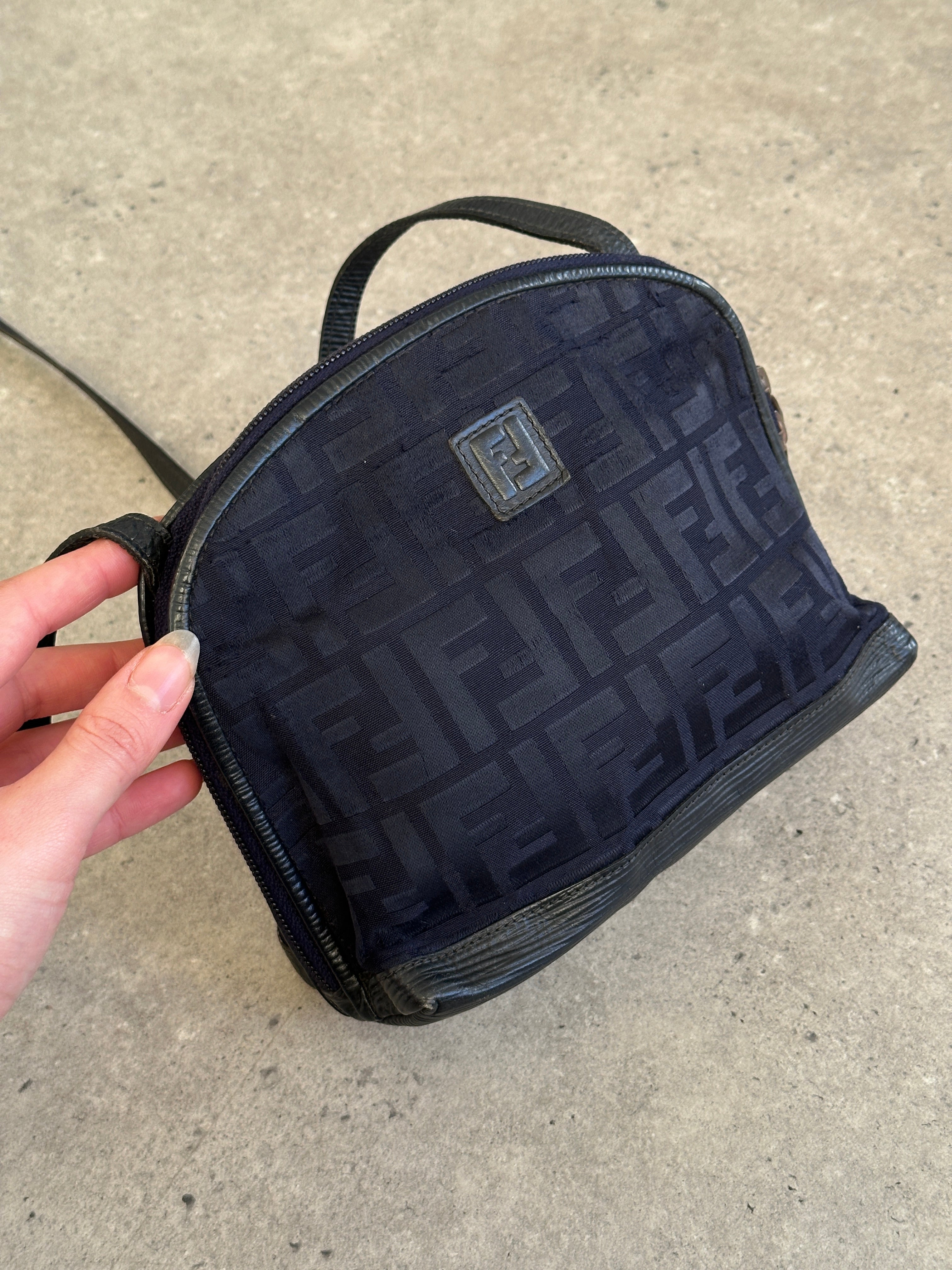 Fendi FF Monogram Crossbody Bag with adjustable strap and gold-tone hardware, showcasing iconic logo pattern.