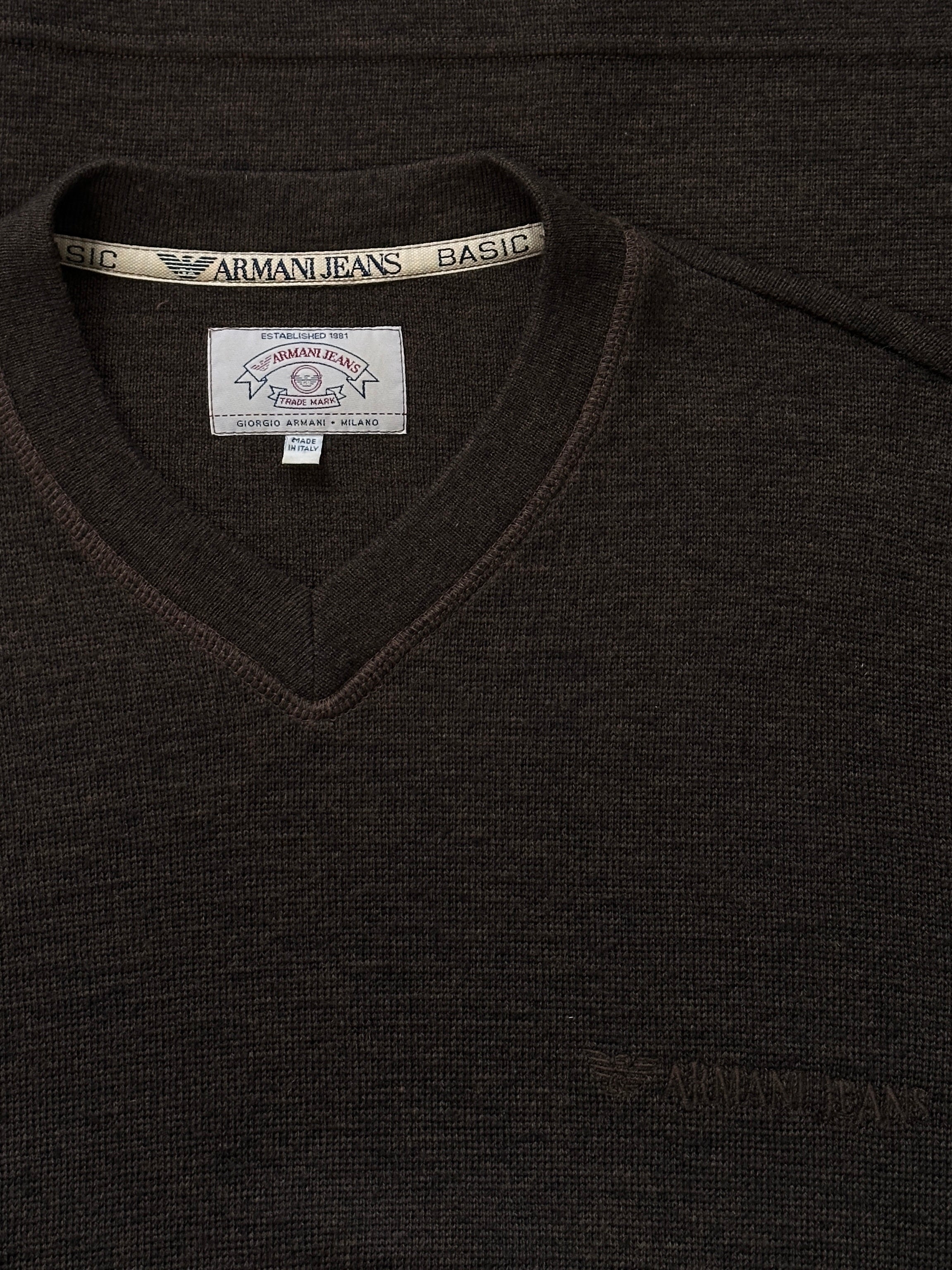 Armani Jeans 2000s wool V-neck knitted jumper in size M, featuring the brand's logo and classic design details.