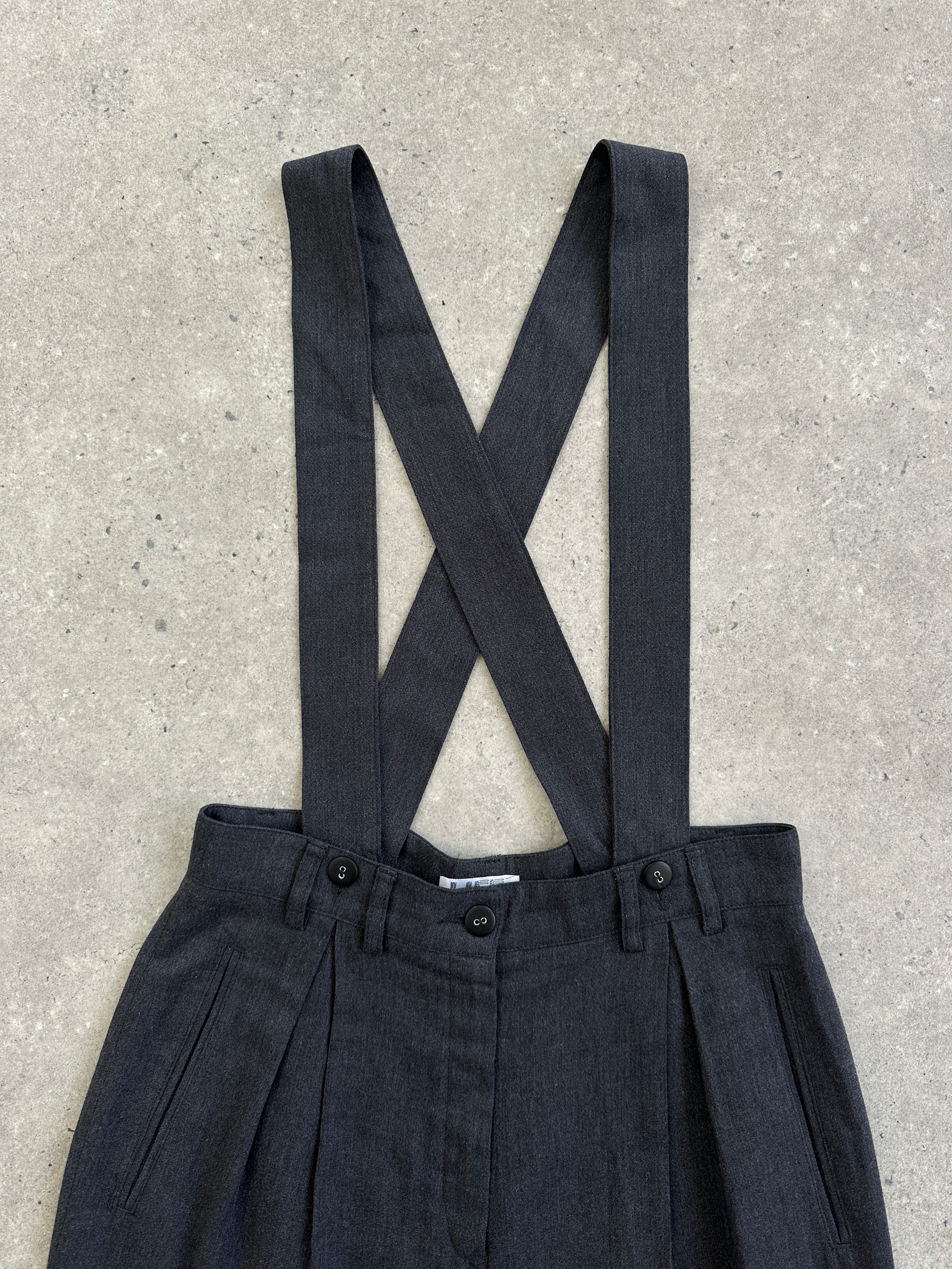 Vintage 1990s pleated tailored trousers with adjustable braces in W26, featuring a classic fit and subtle crease details.
