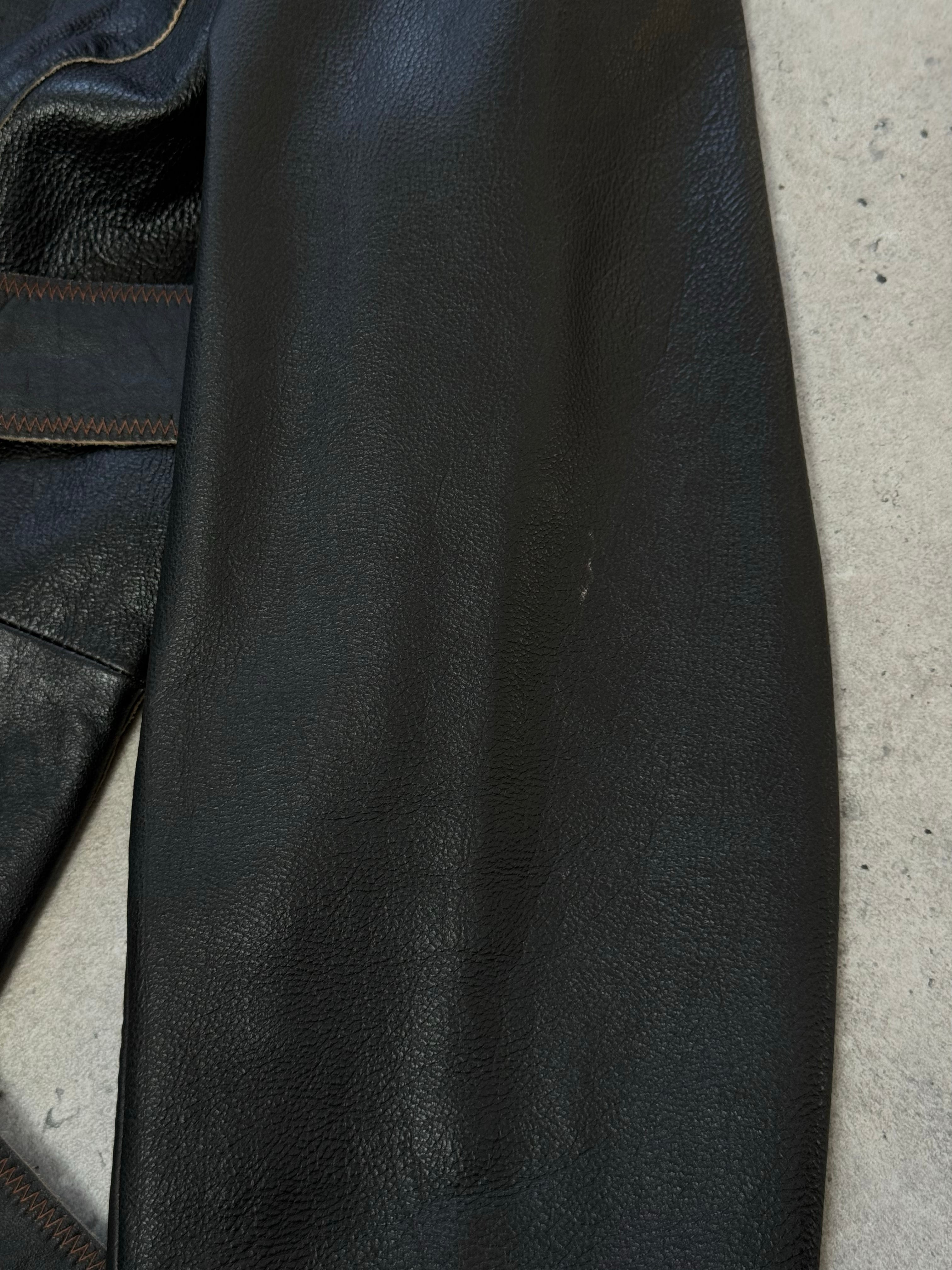 Vintage 1990s leather belted leather jacket with classic design, shown on a mannequin, in size small.