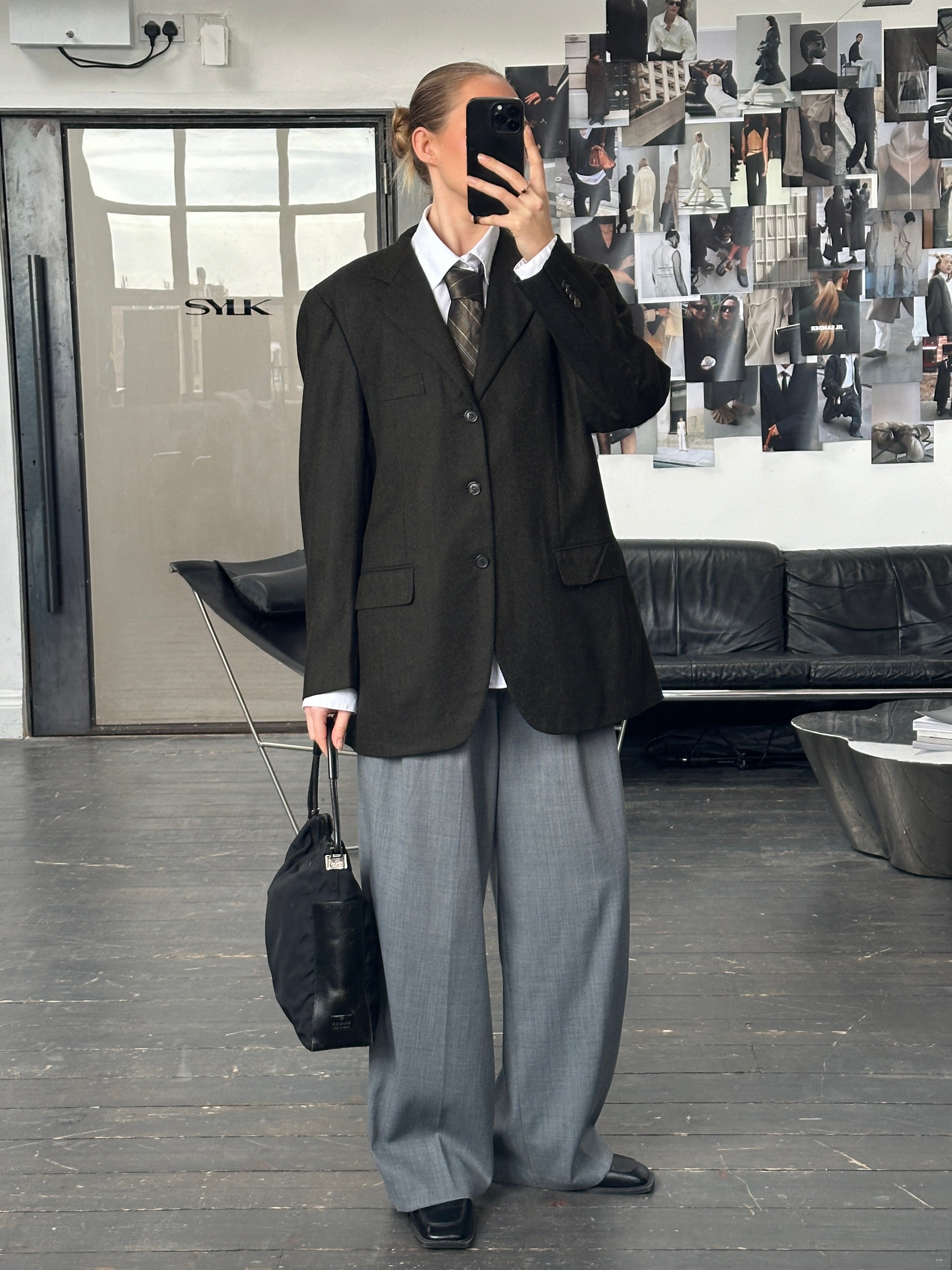 Loro Piana wool and cashmere herringbone blazer in 42R/XL, tailored fit, classic pattern, with lapels and front buttons.