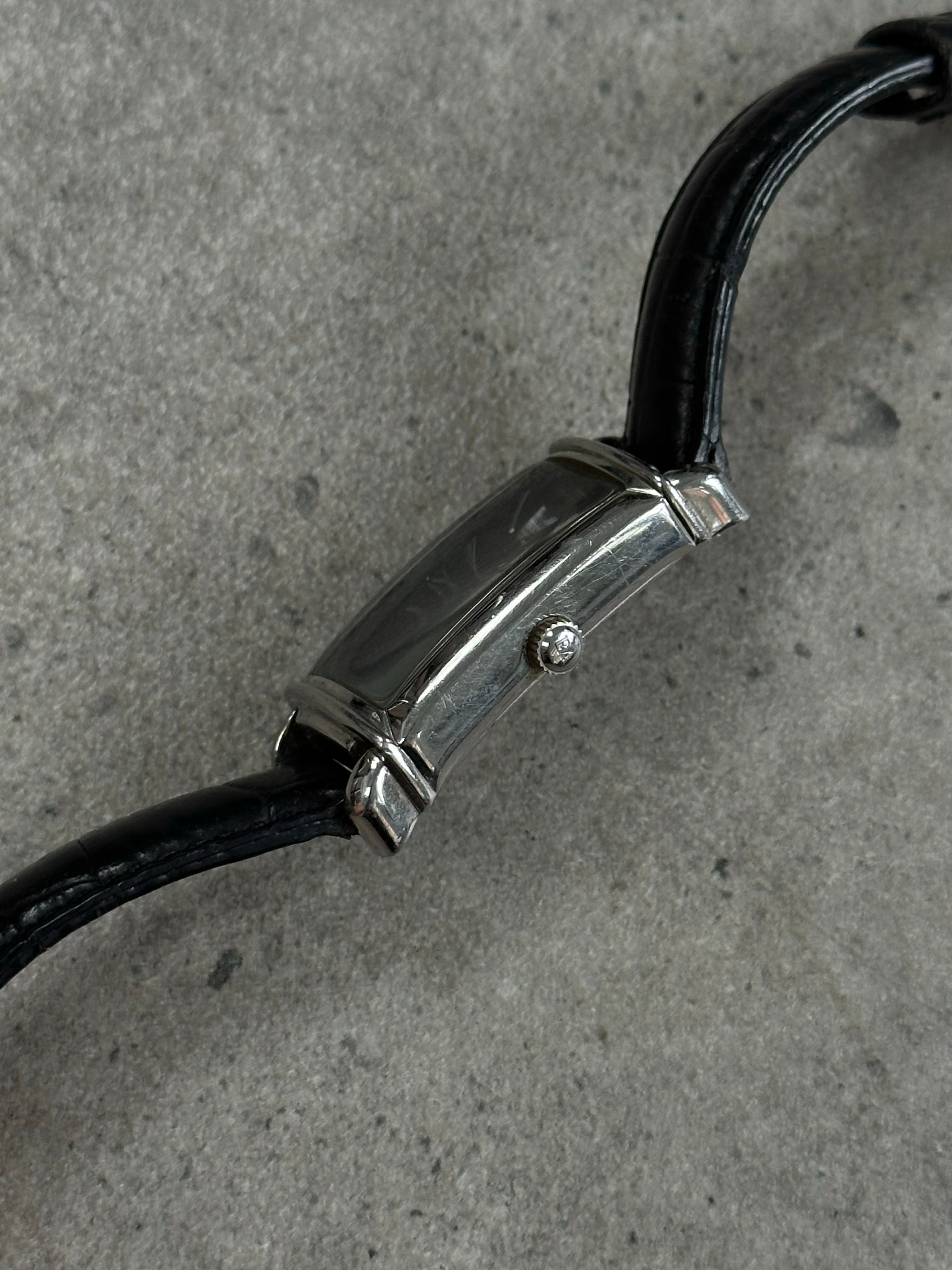 Emporio Armani leather watch from the 2000s with a round dial and black leather strap, showcasing a classic luxury timepiece.