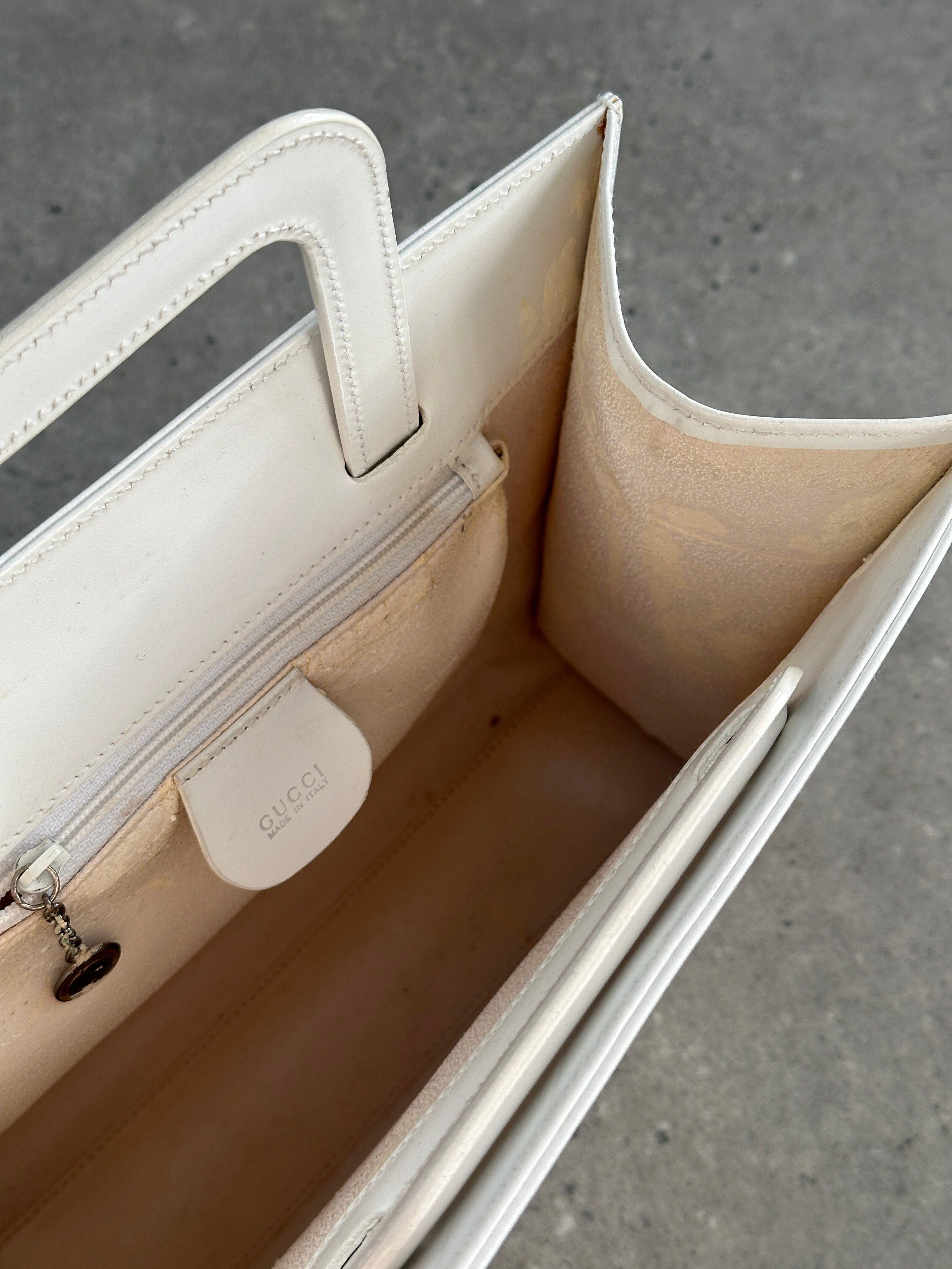 Gucci 1990s Tom Ford 2-in-1 leather and vinyl shoulder bag with adjustable strap and gold-tone hardware.
