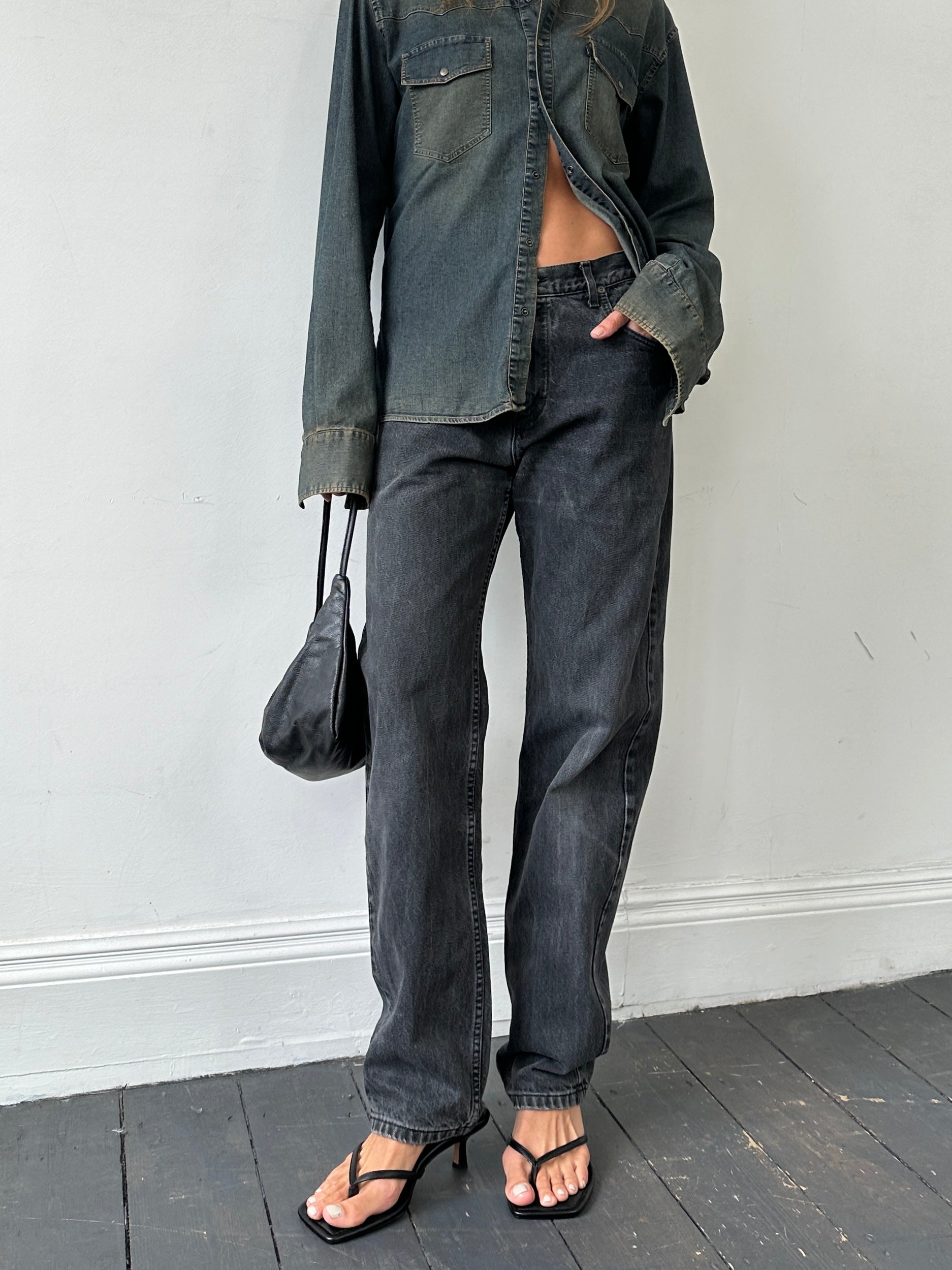 Lee high waisted straight leg denim jeans in W32, showing a close-up of the classic blue denim fabric and fit.