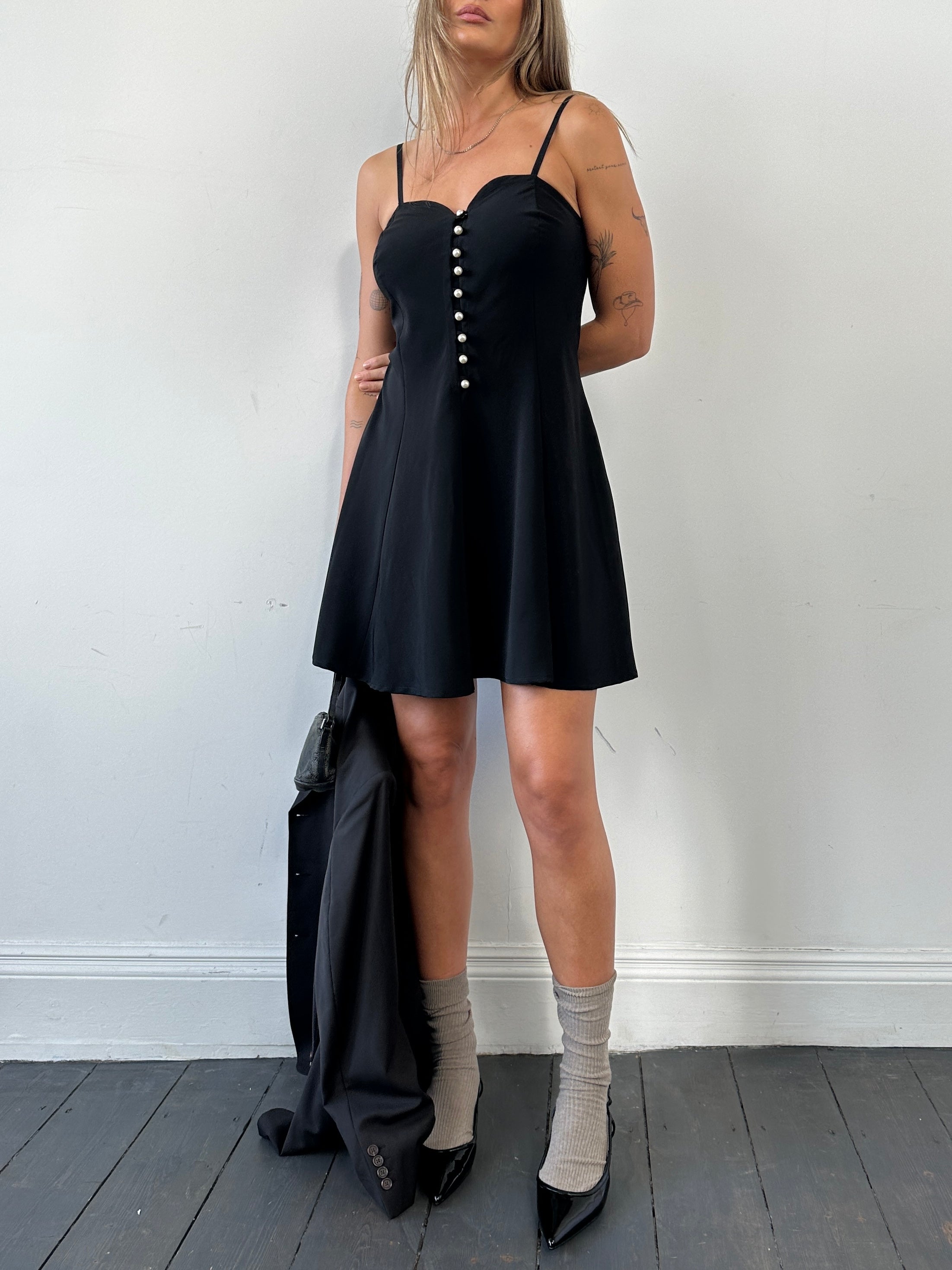 Vintage Italian vintage sweetheart neckline mini dress in size M, featuring elegant fabric and classic design.