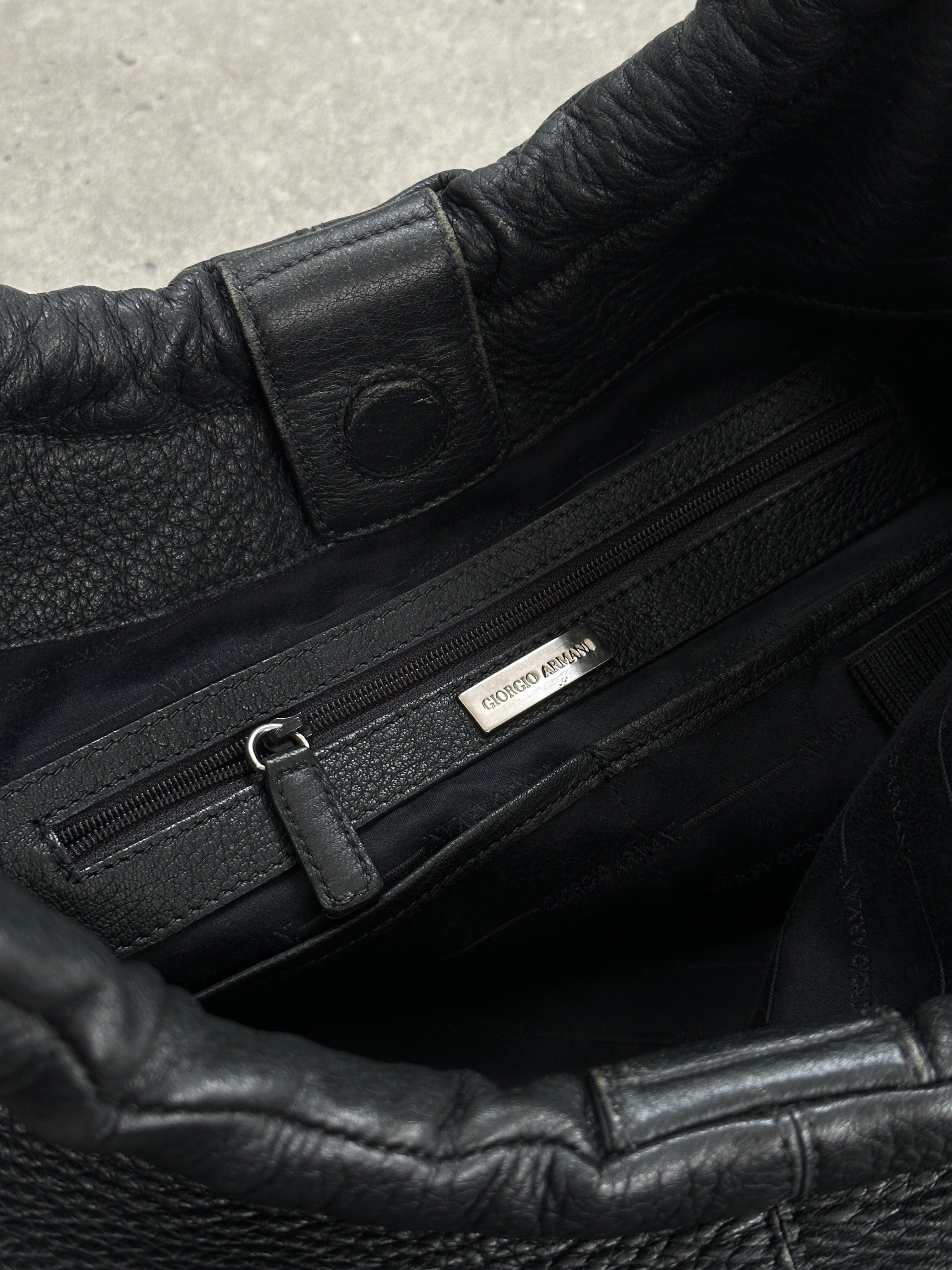 Giorgio Armani leather hobo shoulder bag from the 2000s with a slouchy design and shoulder strap, in rich brown leather.
