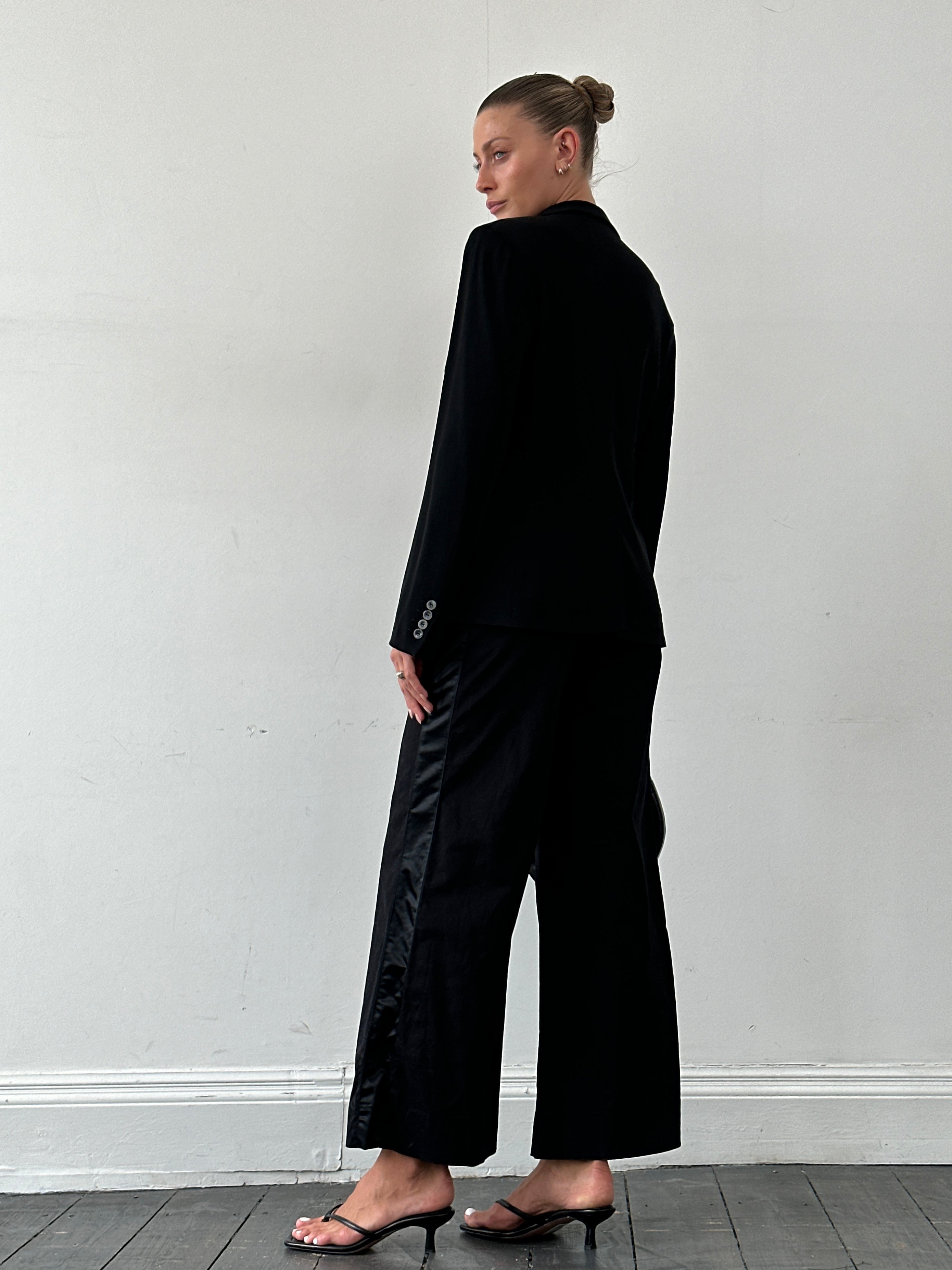 Gianfranco Ferre wide leg low waist tuxedo trousers in black, showing the tailored fit and sleek design.