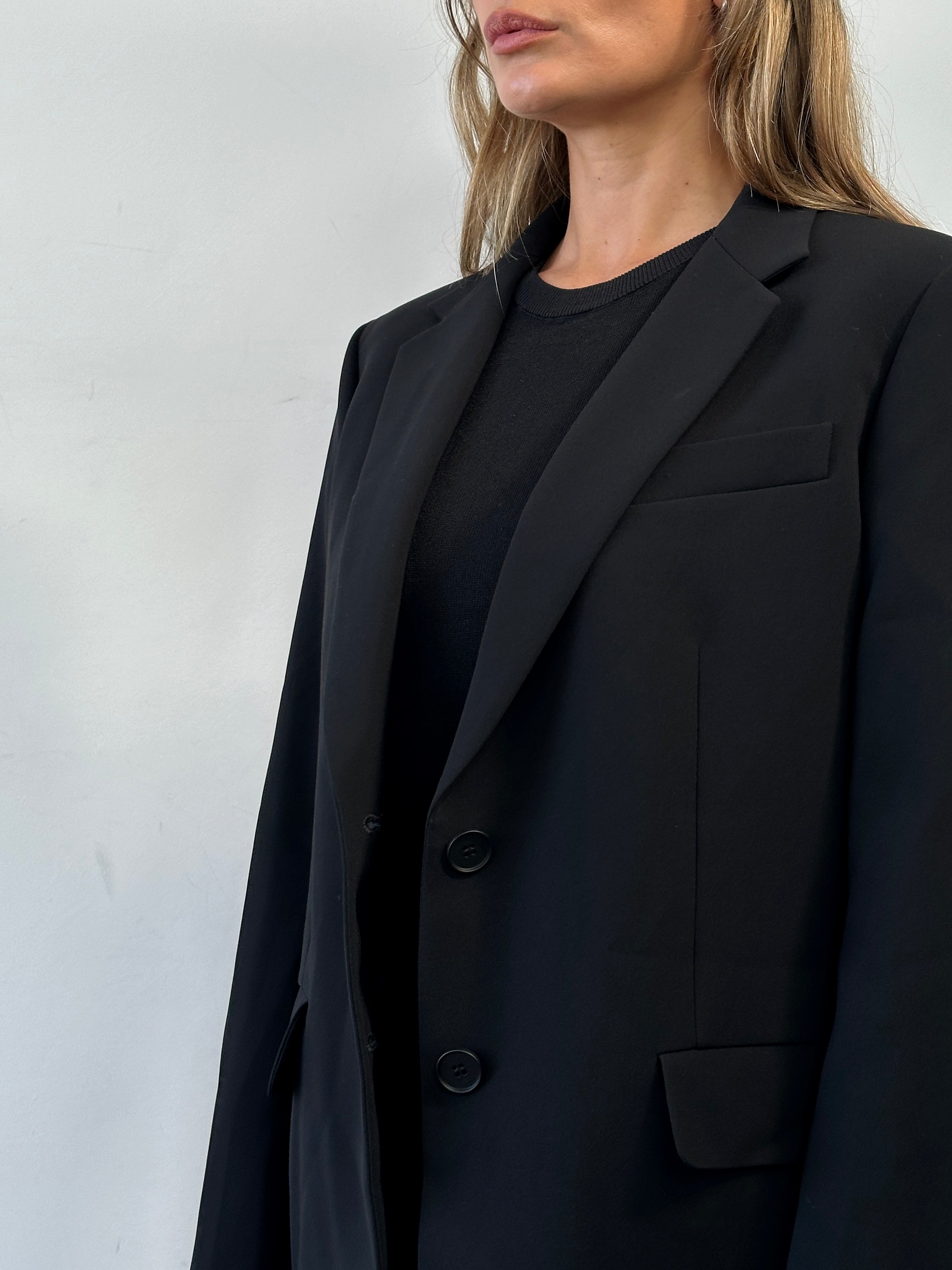Max Mara Studio single-breasted blazer in size M/L, tailored fit with classic lapels and sleek design, shown on a neutral background.