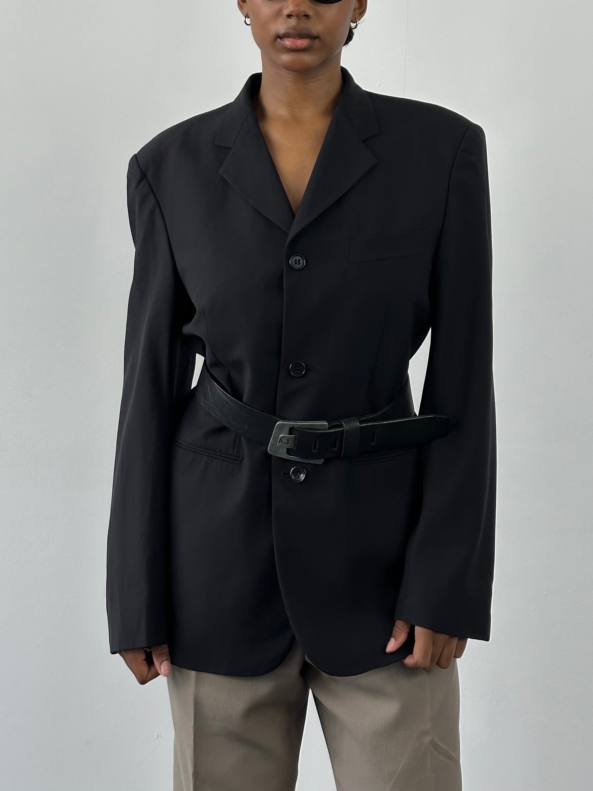 Yves Saint Laurent Pour Homme 1990s pure wool blazer in size 40R/L, tailored fit, classic design with lapel collar and button closure.