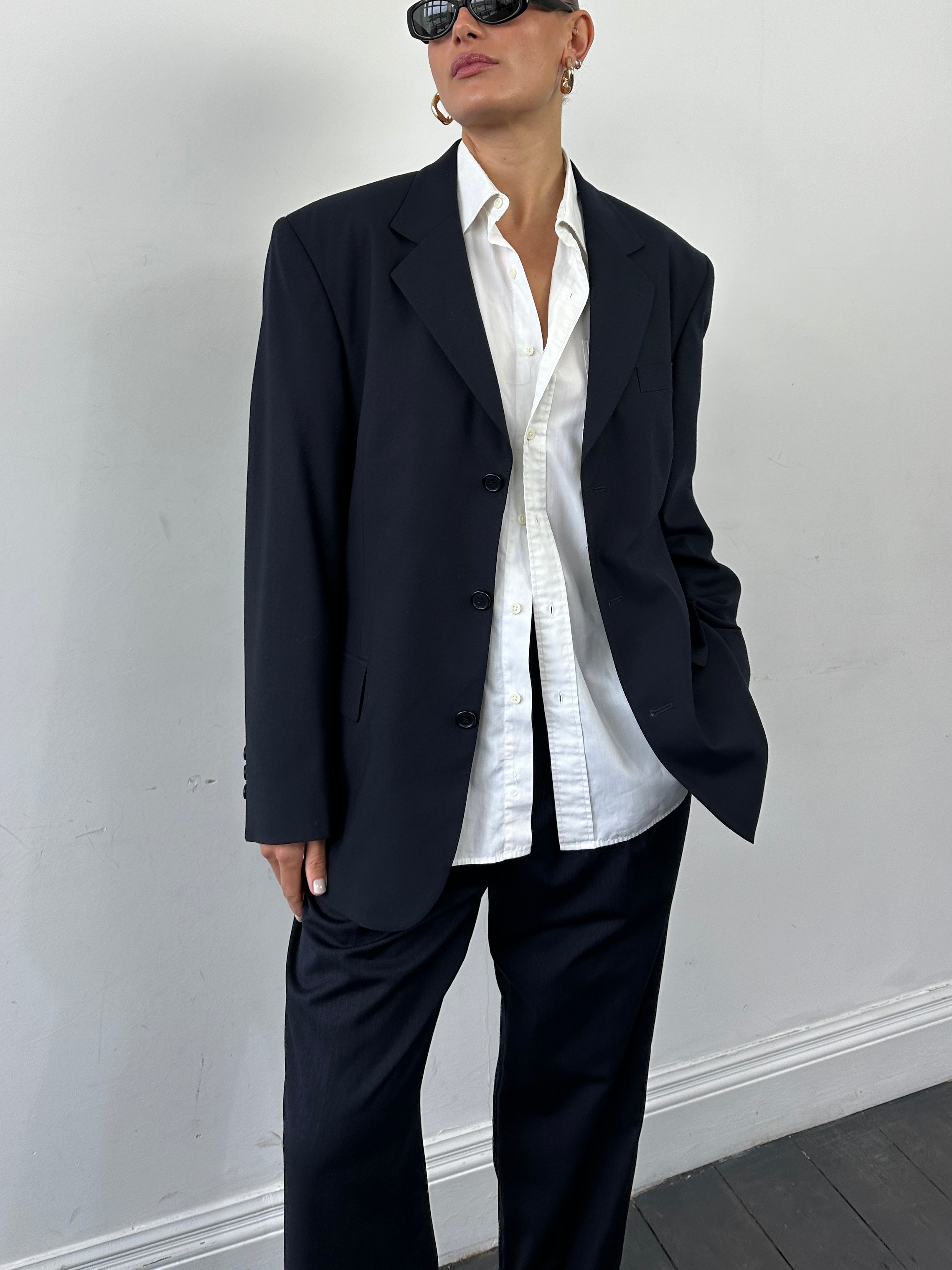 Vintage Virgin Wool Single Breasted Blazer in size 40R/L, tailored fit with classic lapel and button closure, shown on a hanger.