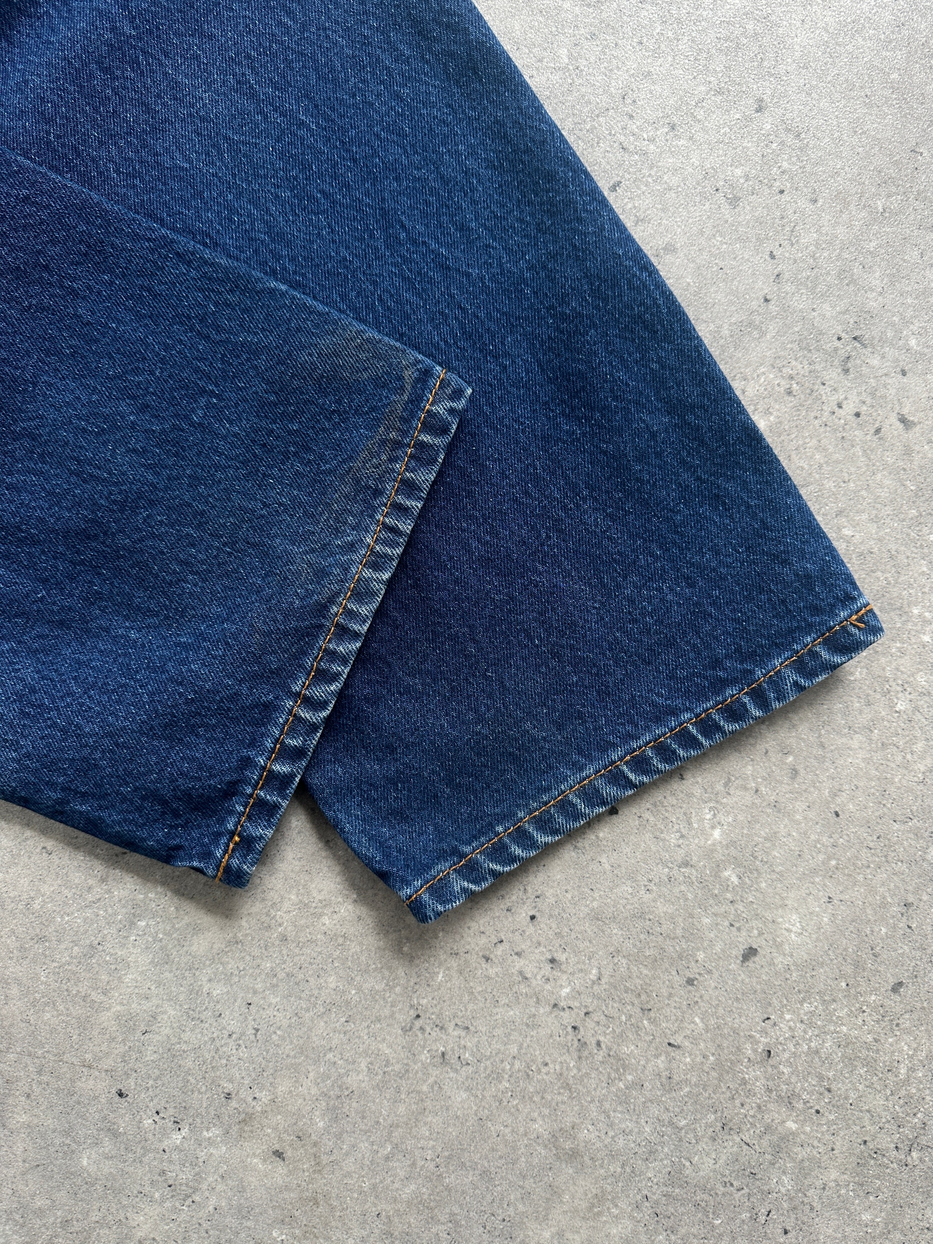 Vintage pure cotton straight leg denim jeans in size W28, displayed flat with classic blue wash and clean stitching.