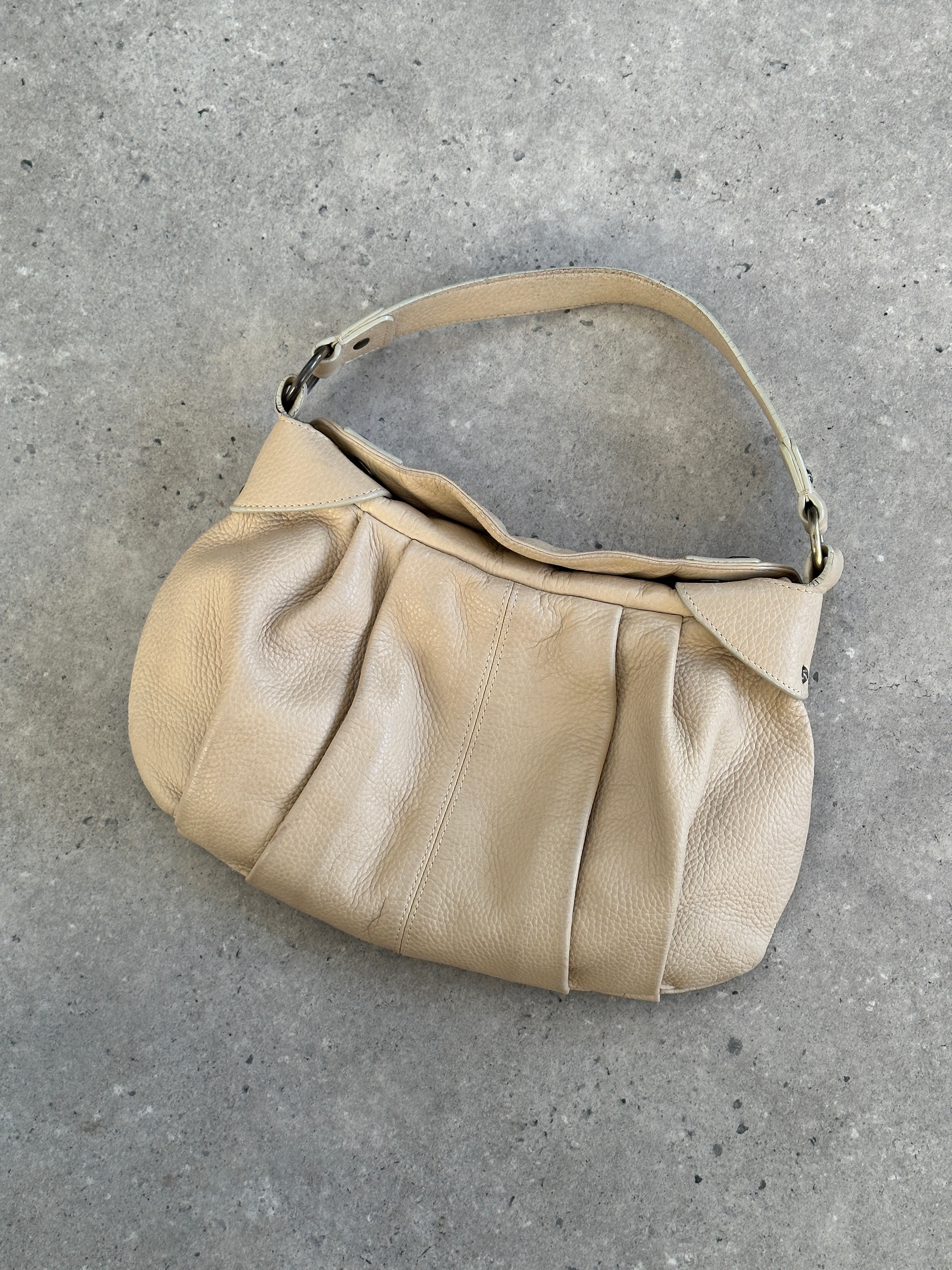Emporio Armani leather pleated shoulder bag from the 2000s, stylish designer bag with a structured shape and shoulder strap.