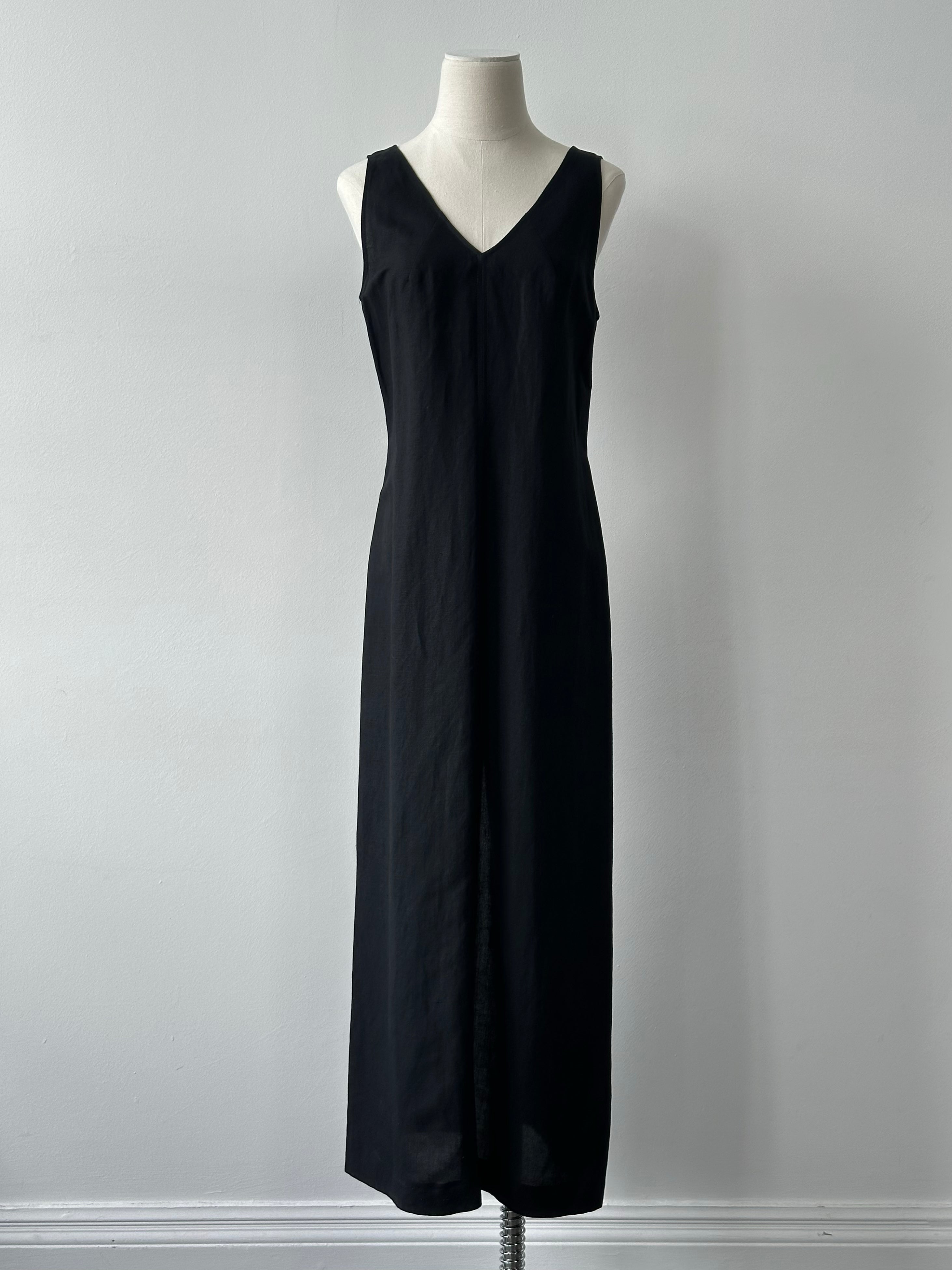 Marella 1990s linen V-neck floor-length dress in white, with a relaxed fit and elegant design, displayed on a hanger.