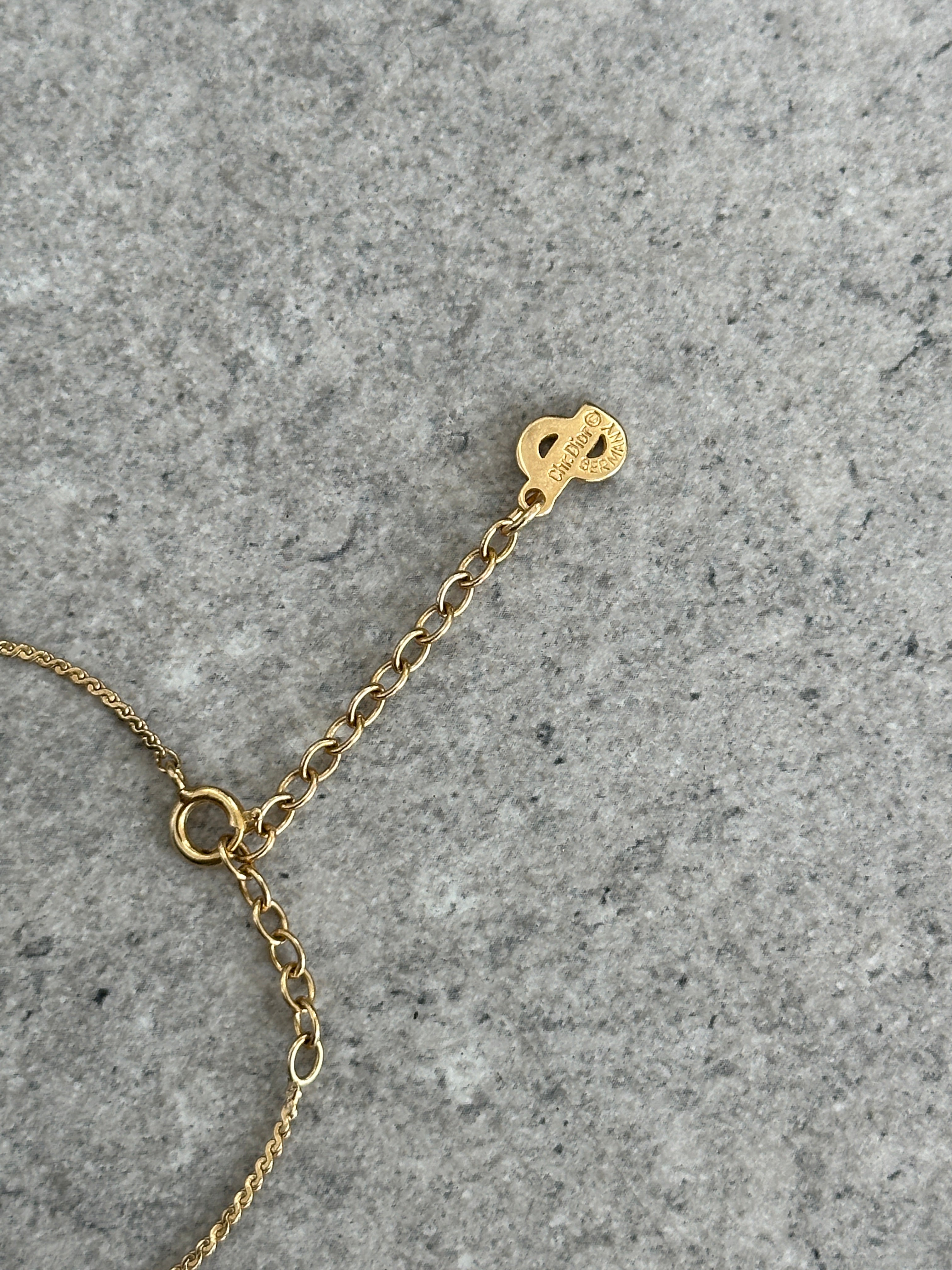 Christian Dior 1990s gold plated CD logo pendant necklace with 16-inch chain, featuring iconic designer jewelry design.