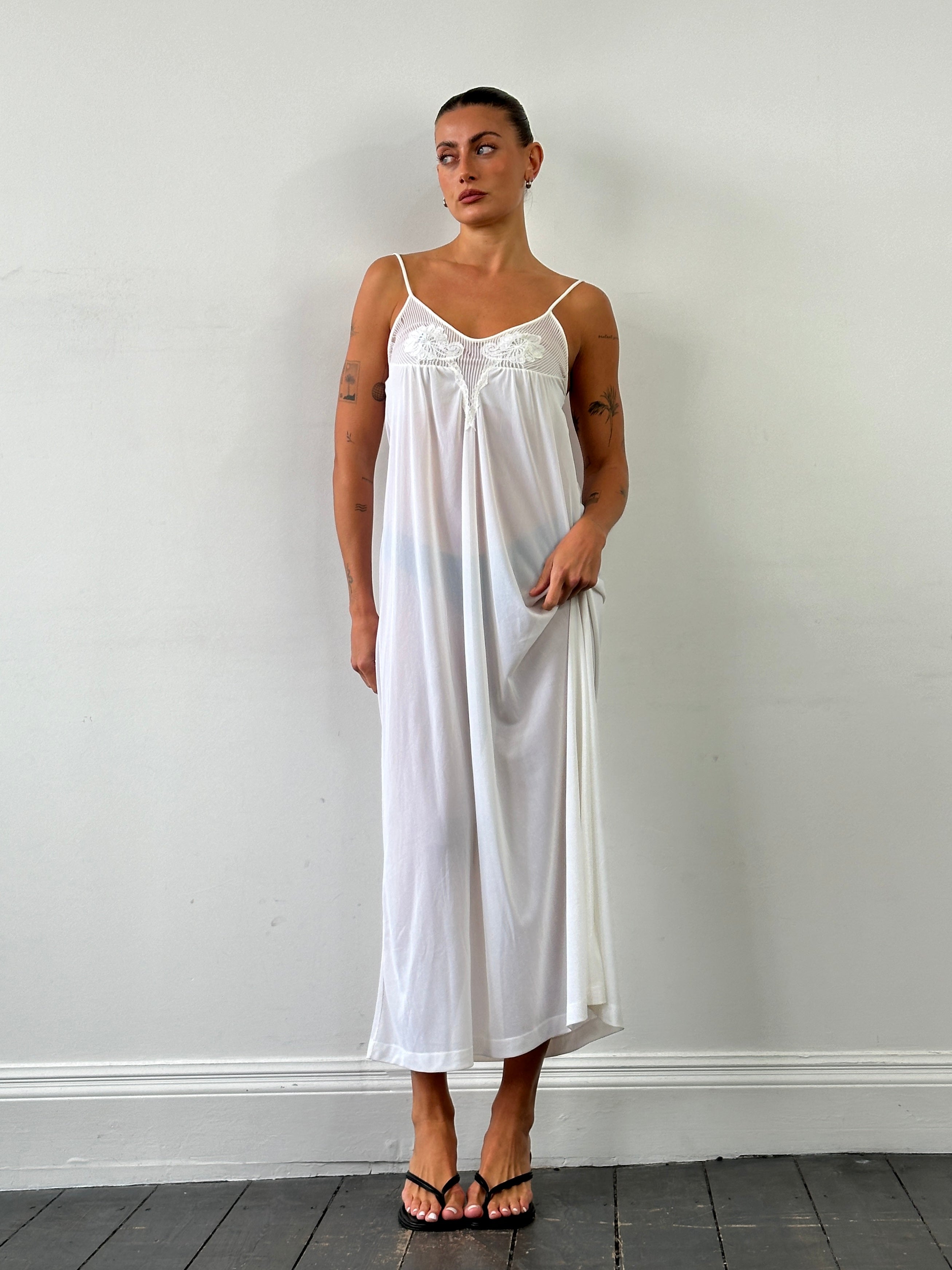 Vintage sheer maxi slip dress in S/M style, flowing fabric, elegant design, perfect for casual or evening wear.