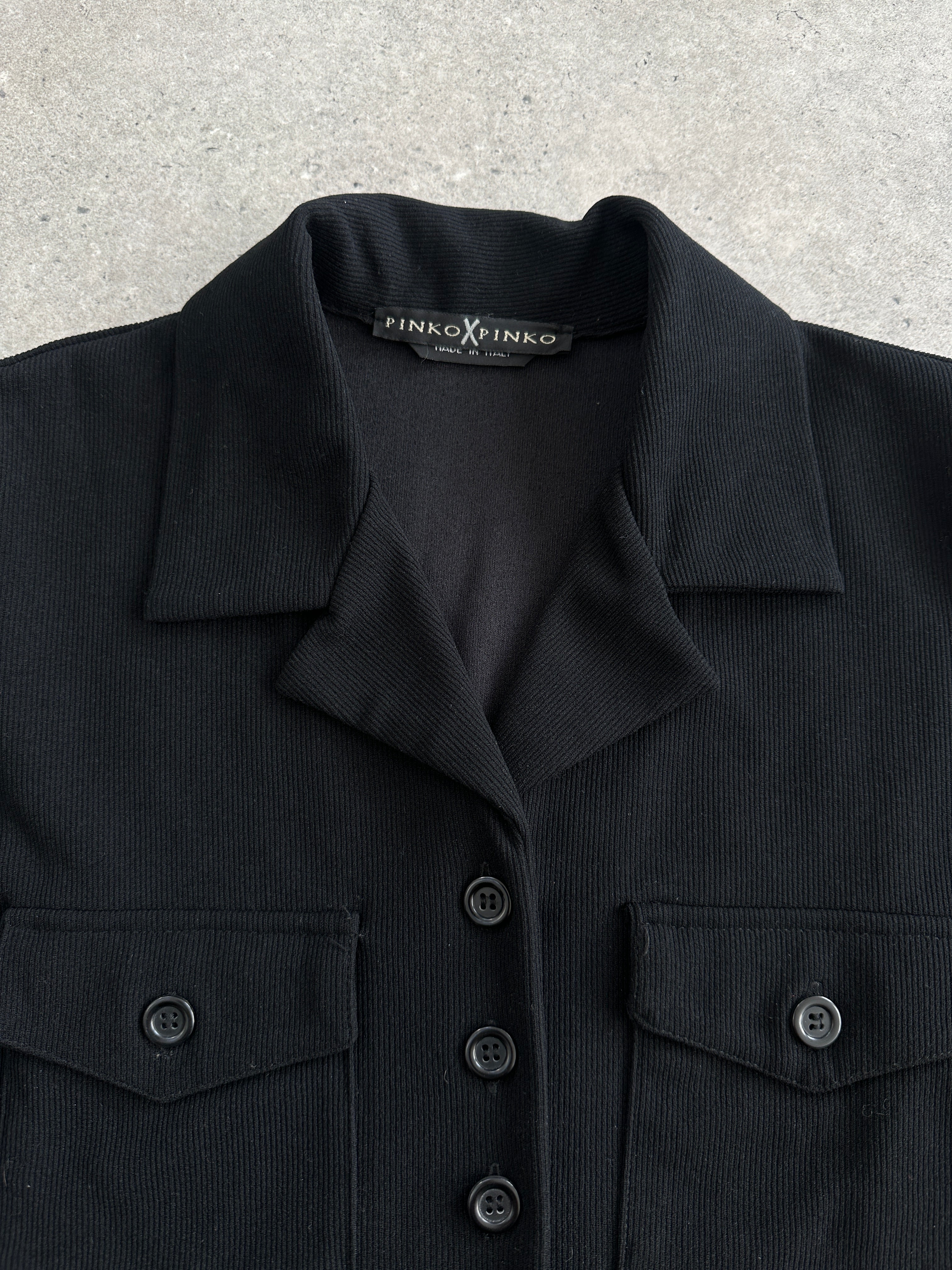 Italian Vintage fitted ribbed shirt in size small, showcasing the classic design and textured fabric.
