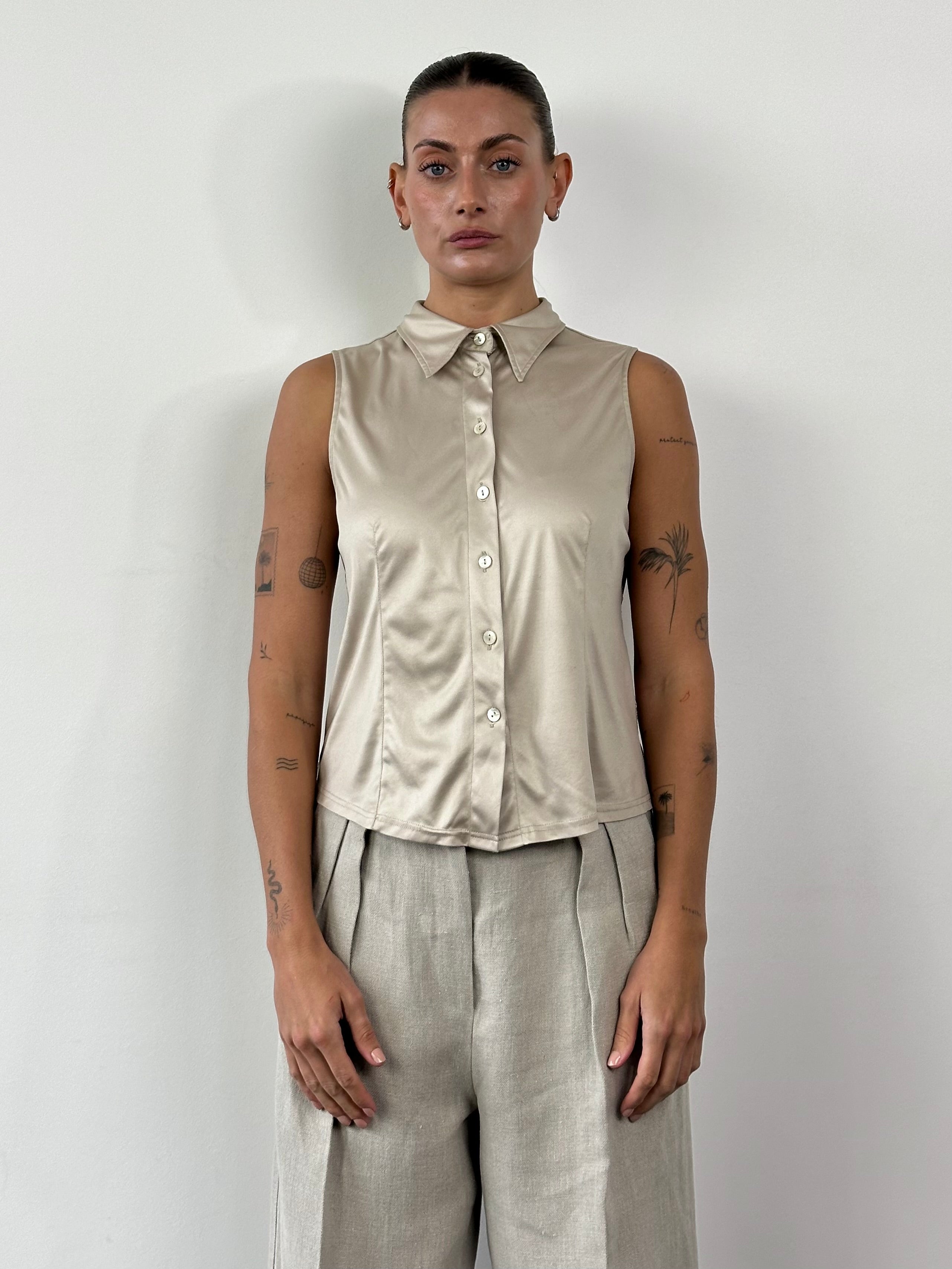 Fendi sleeveless satin logo shirt in size M/L, featuring a smooth satin fabric and the iconic Fendi logo print.