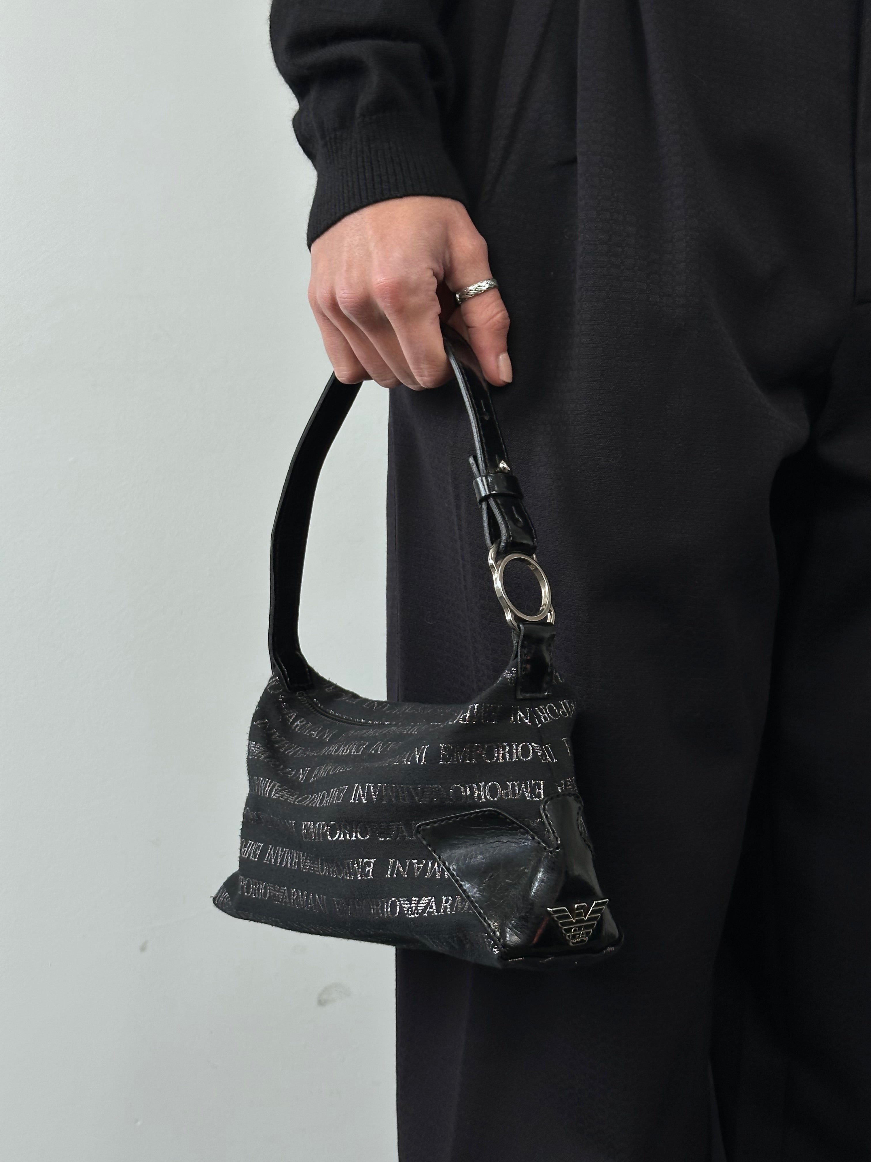 Emporio Armani Monogram Shoulder Bag featuring signature logo pattern and sleek design, perfect for stylish everyday use.