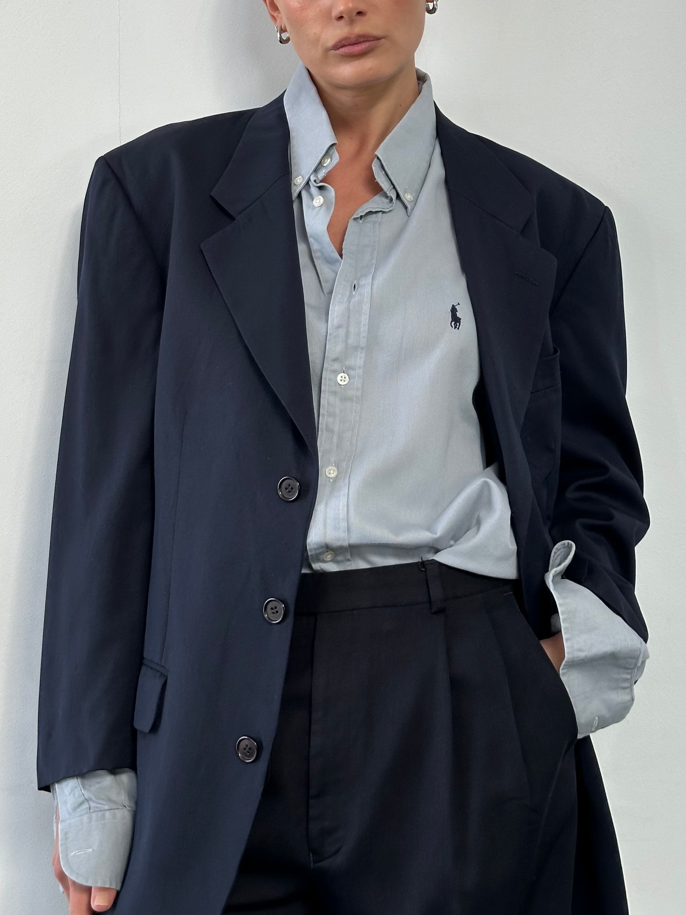 Yves Saint Laurent Pour Homme 1990s wool single-breasted blazer in size L/XL, tailored fit, with notch lapel and classic design.